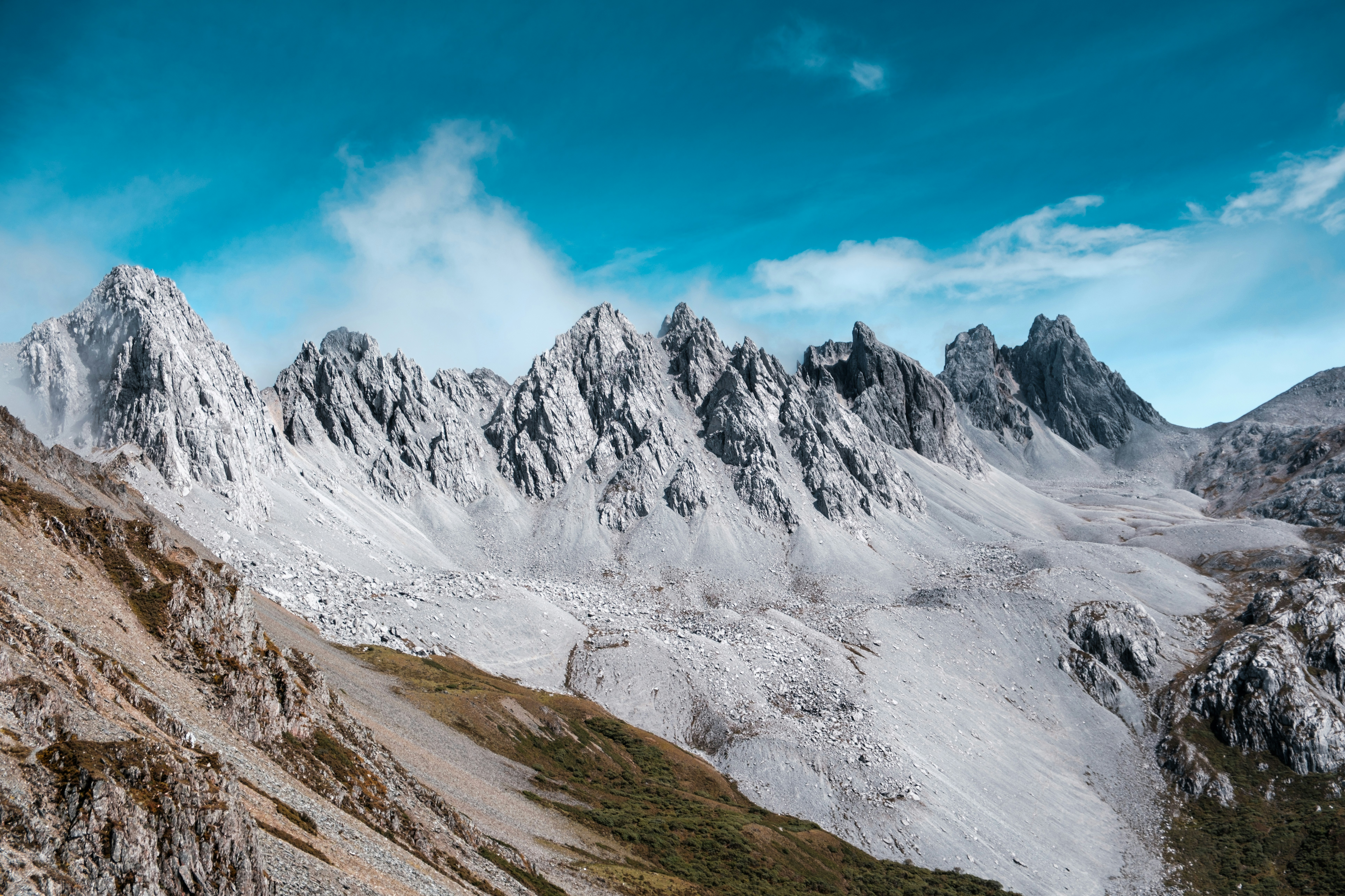 A view of a mountain range from the top of a mountain