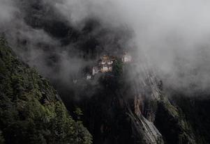 A mountain with a small village on top of it