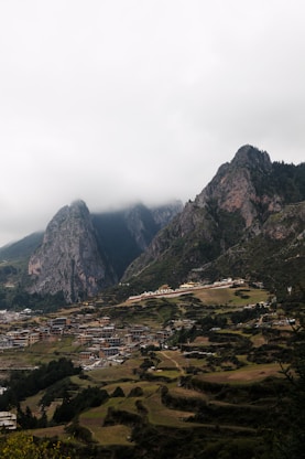 A view of a valley with mountains in the background