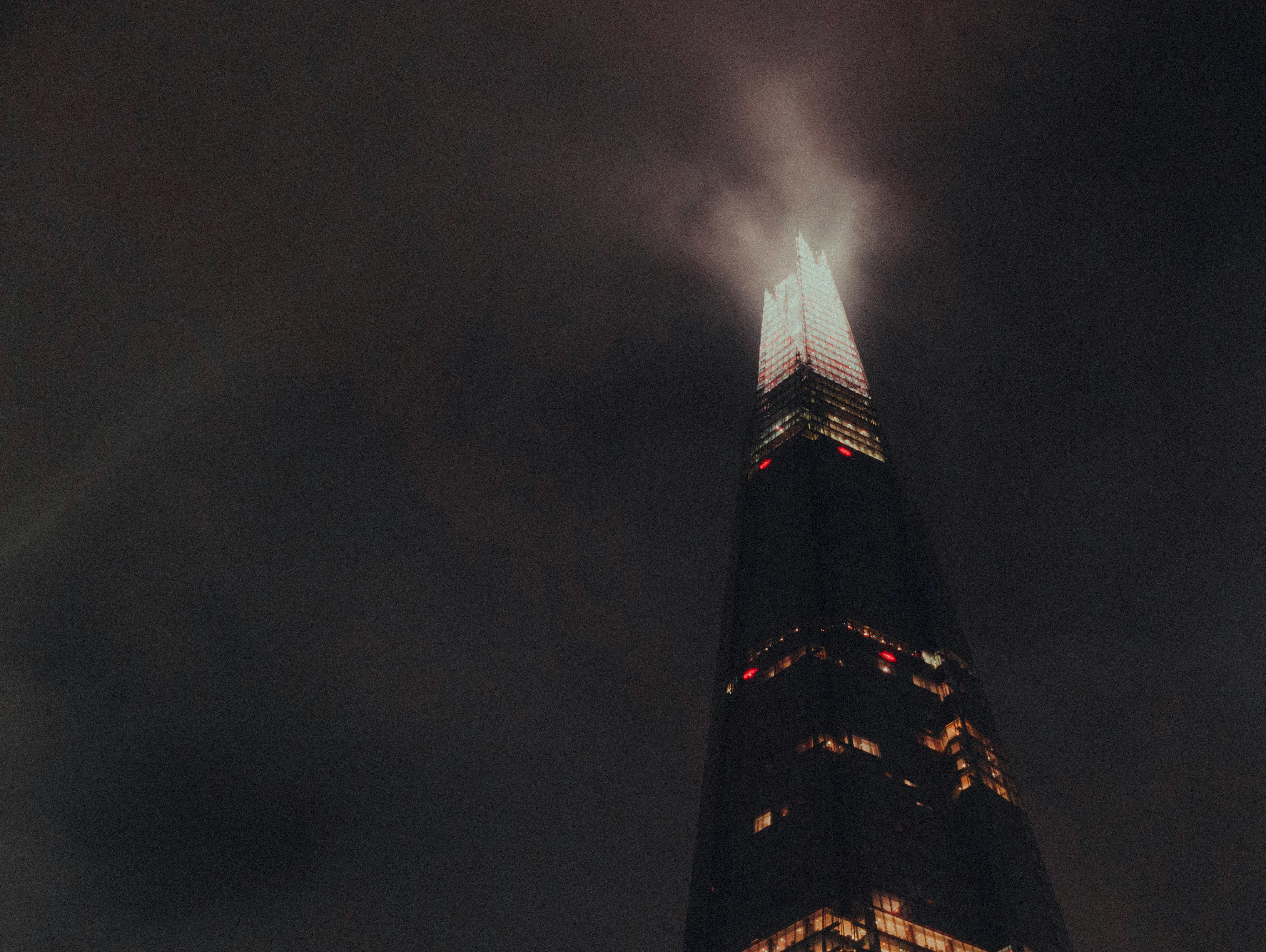 A very tall building lit up at night