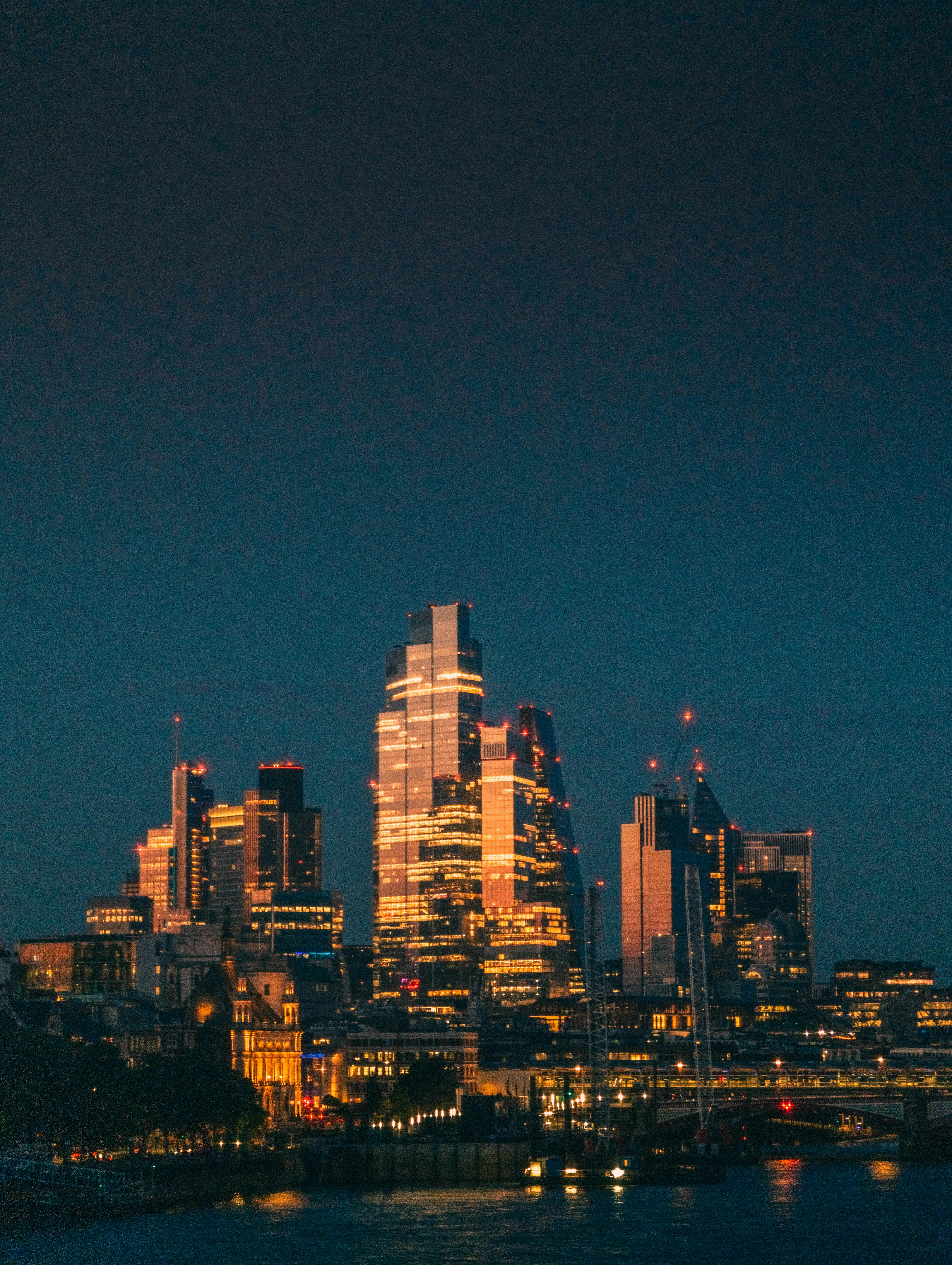 A view of a city at night from across the water