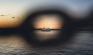 A view of a boat in the water through a magnifying glass