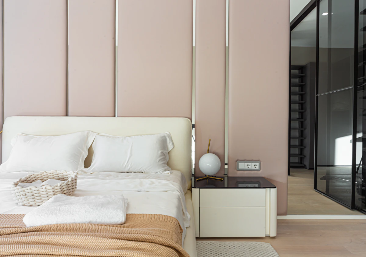 Pink bedroom with white furniture showing a soft pink preppy room color direction
