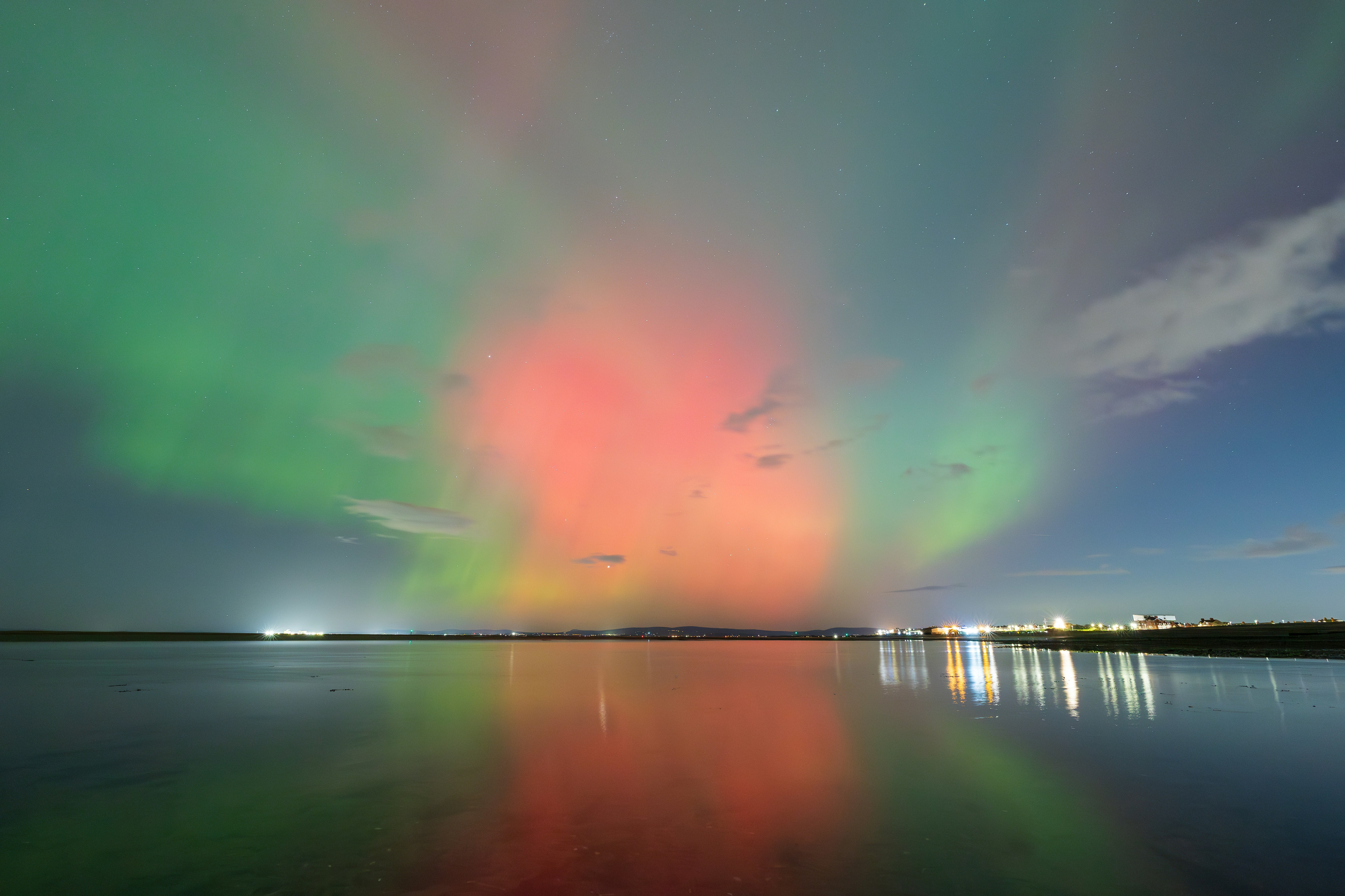 A colorful sky is reflected in the water
