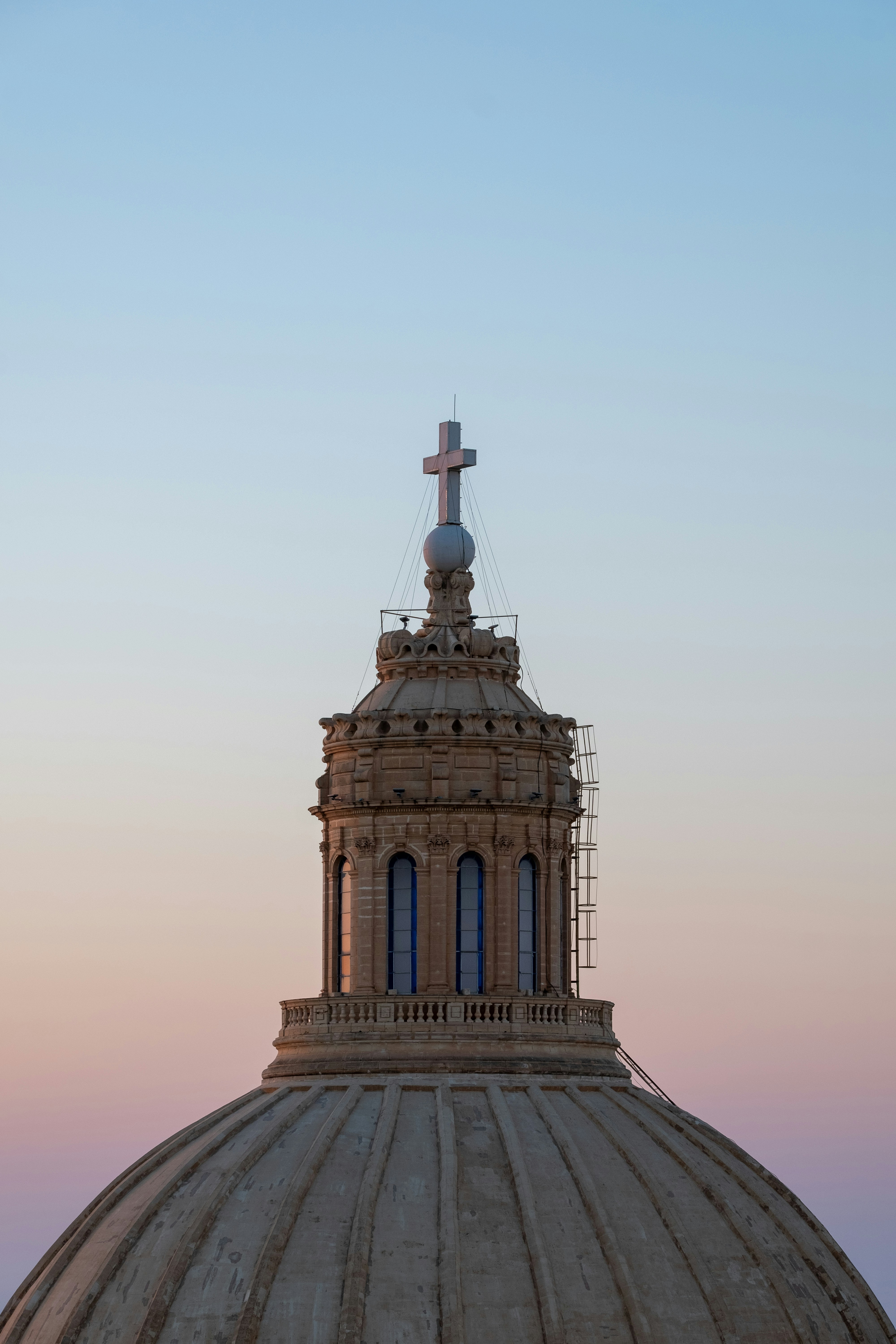A dome with a cross on top of it