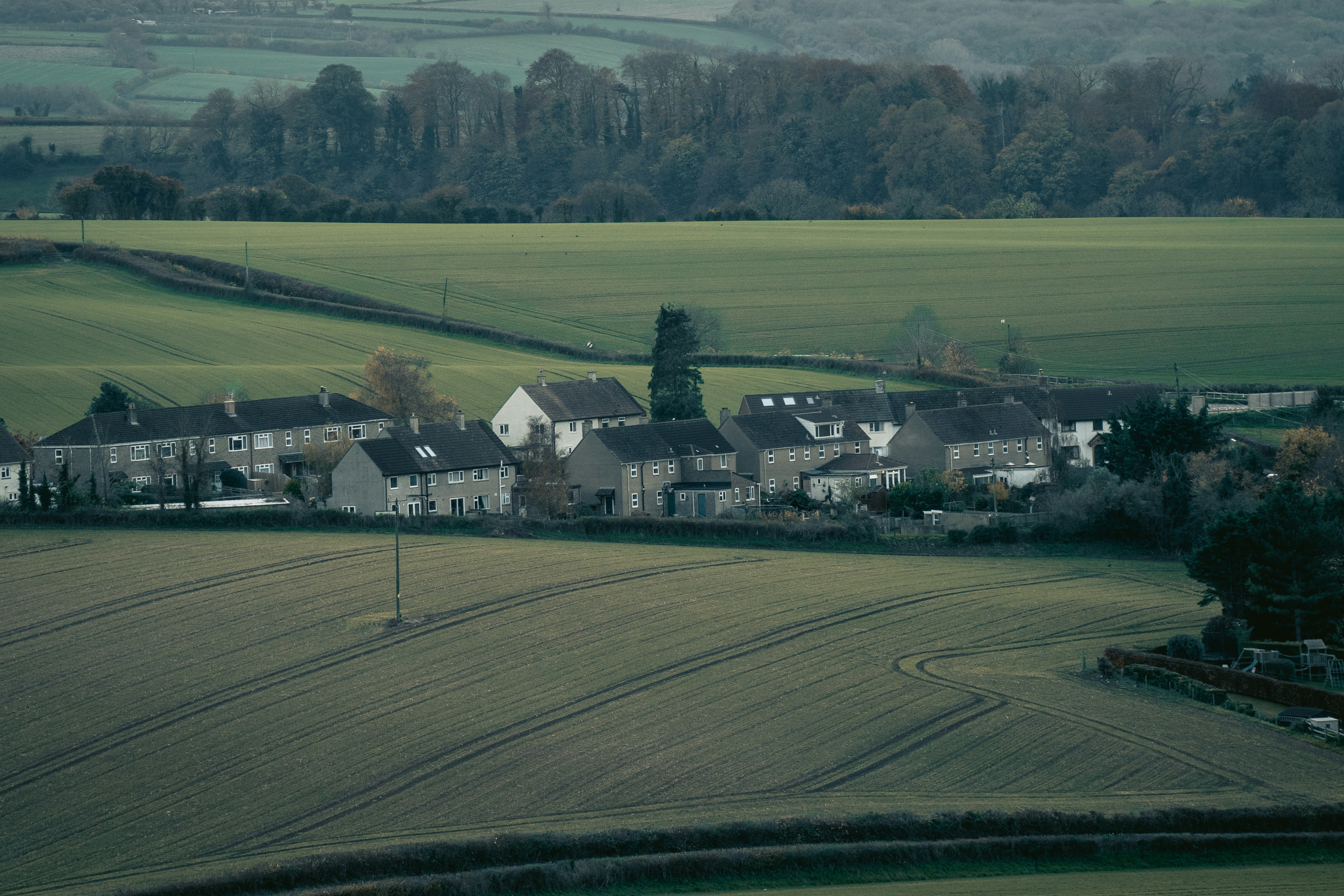 A view of a small town in the middle of a field