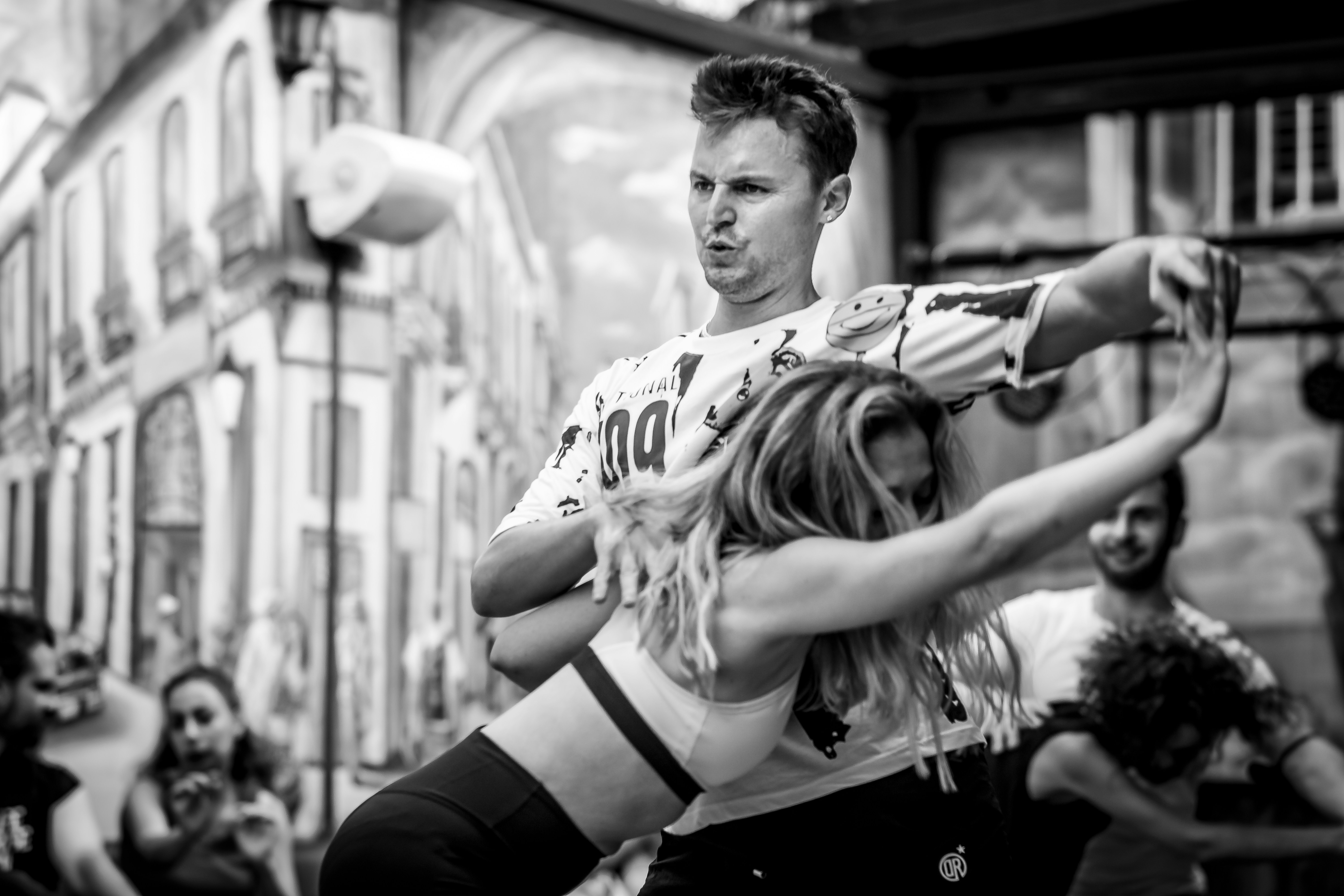 A couple of people that are standing in the street