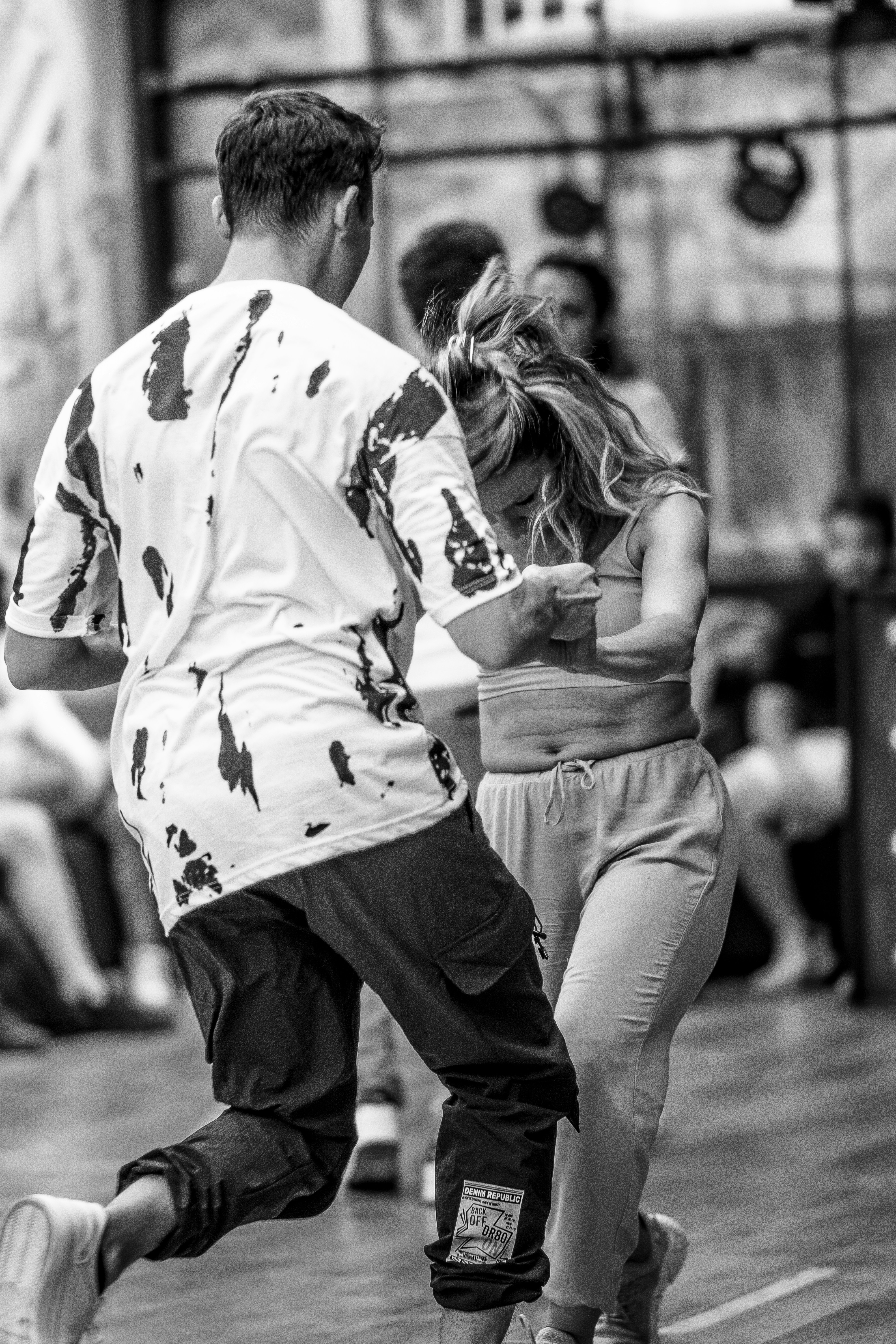 A couple of people that are standing in the street