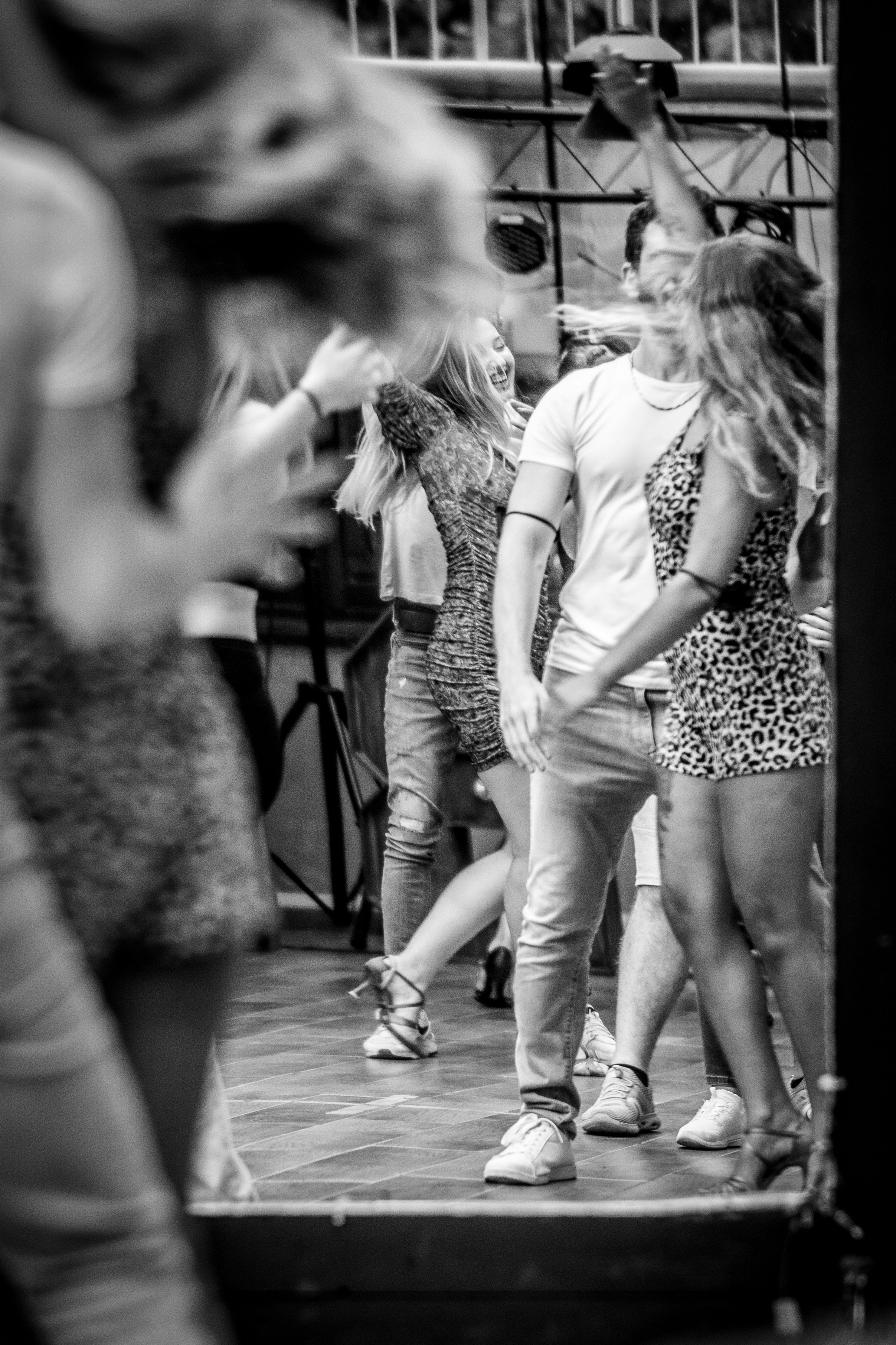 A black and white photo of a group of people dancing
