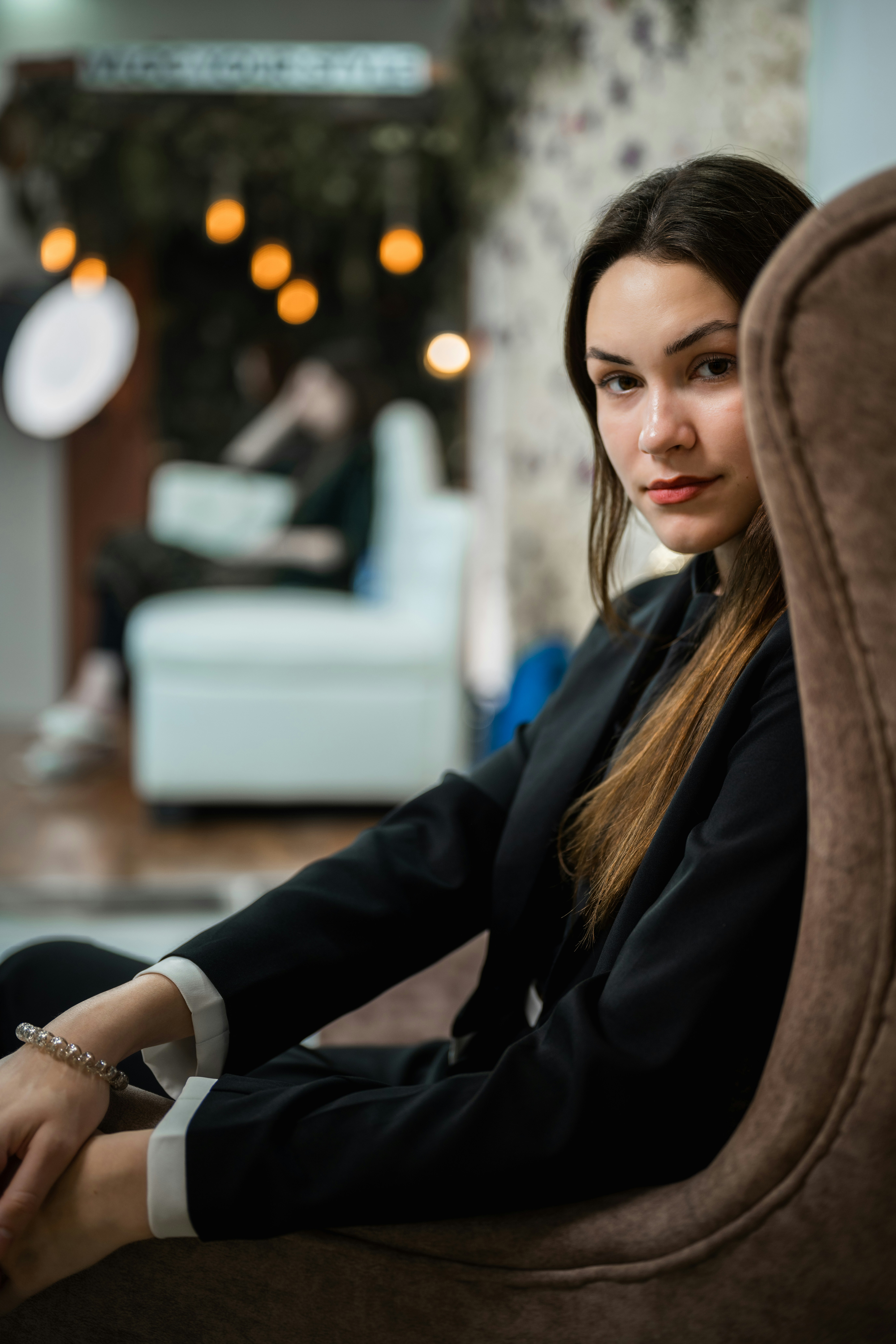 A woman sitting in a chair in a room