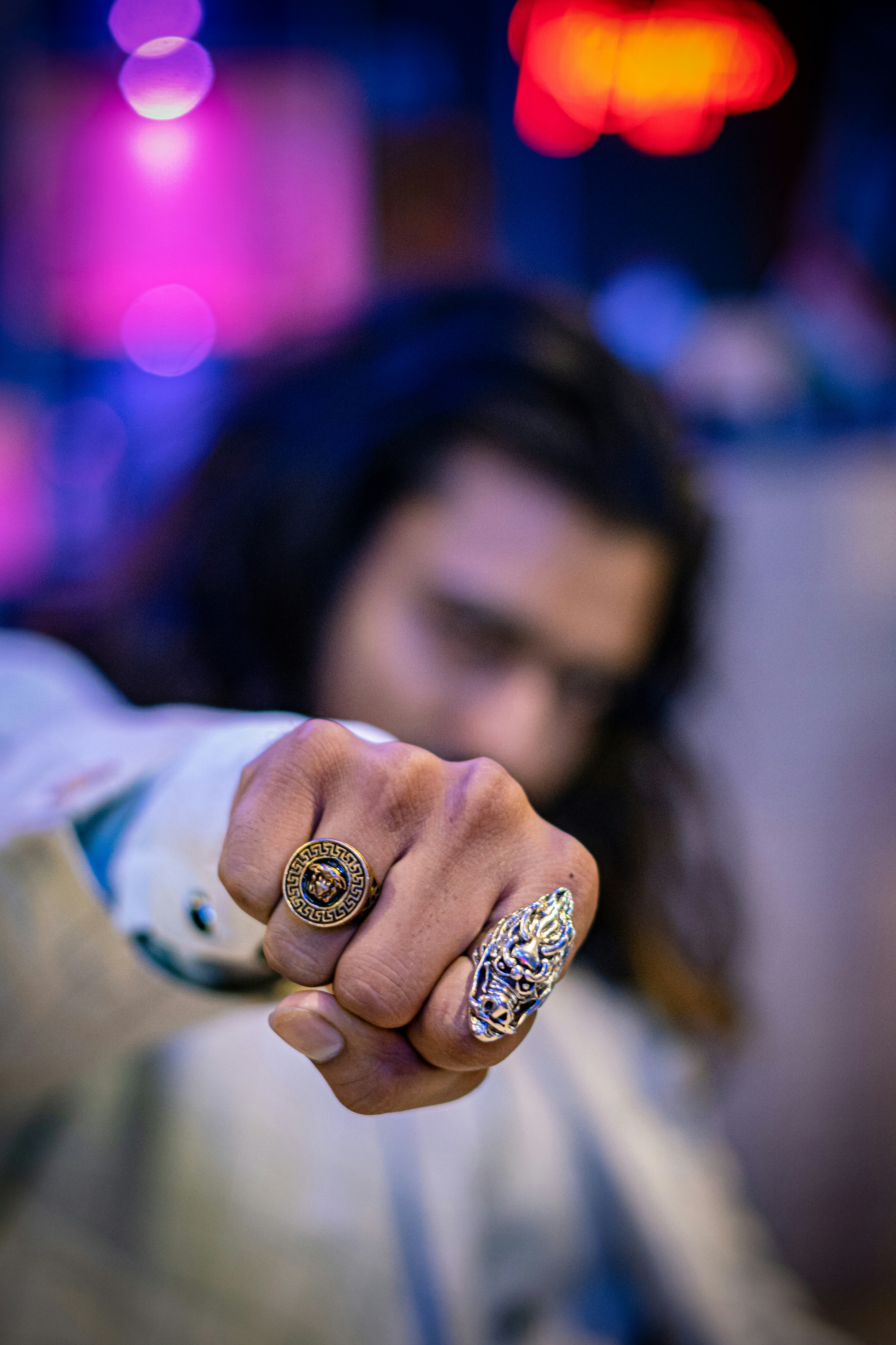 A man pointing a gun at the camera