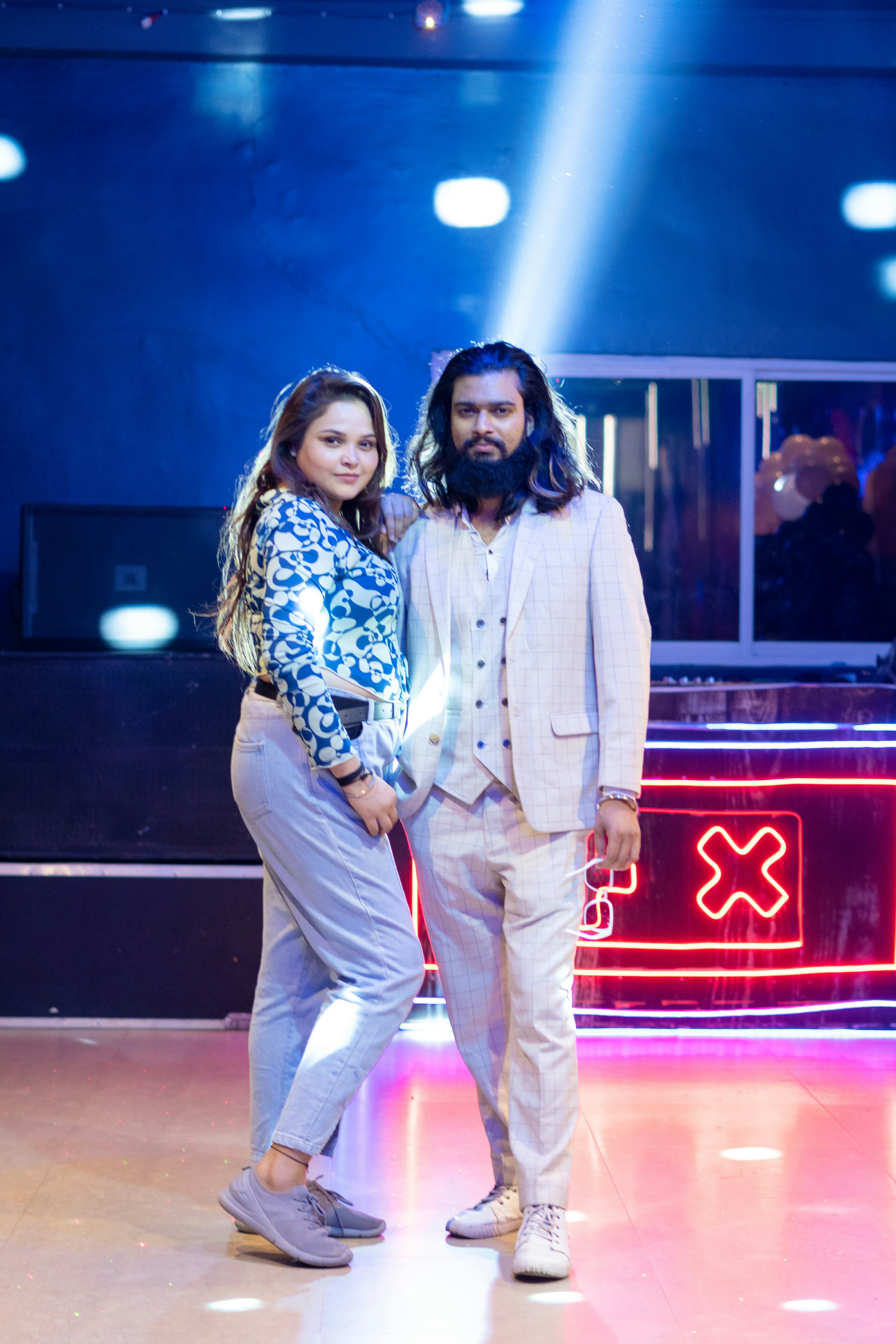 A man and a woman standing on a dance floor
