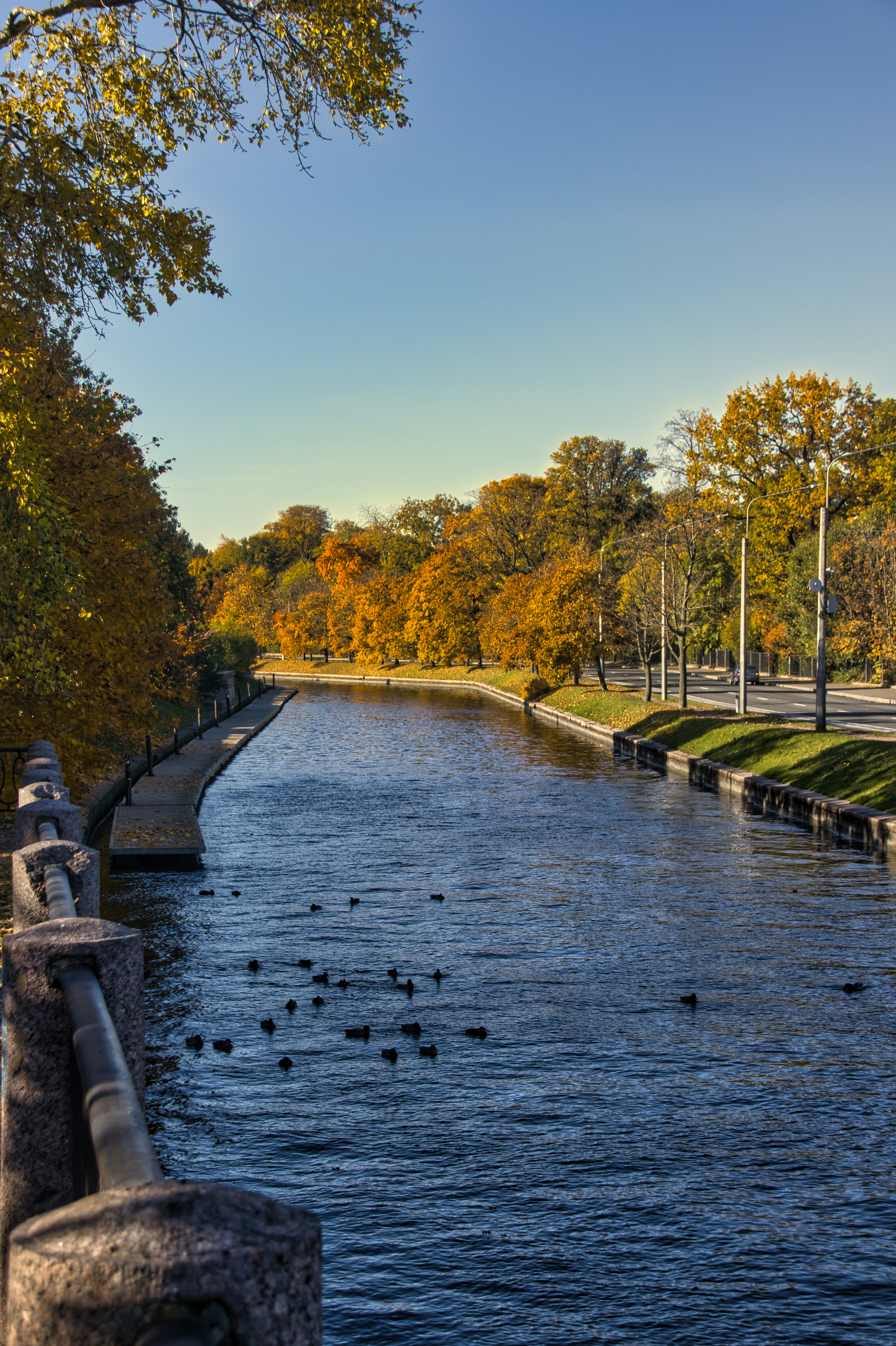 A river running through a park next to a park
