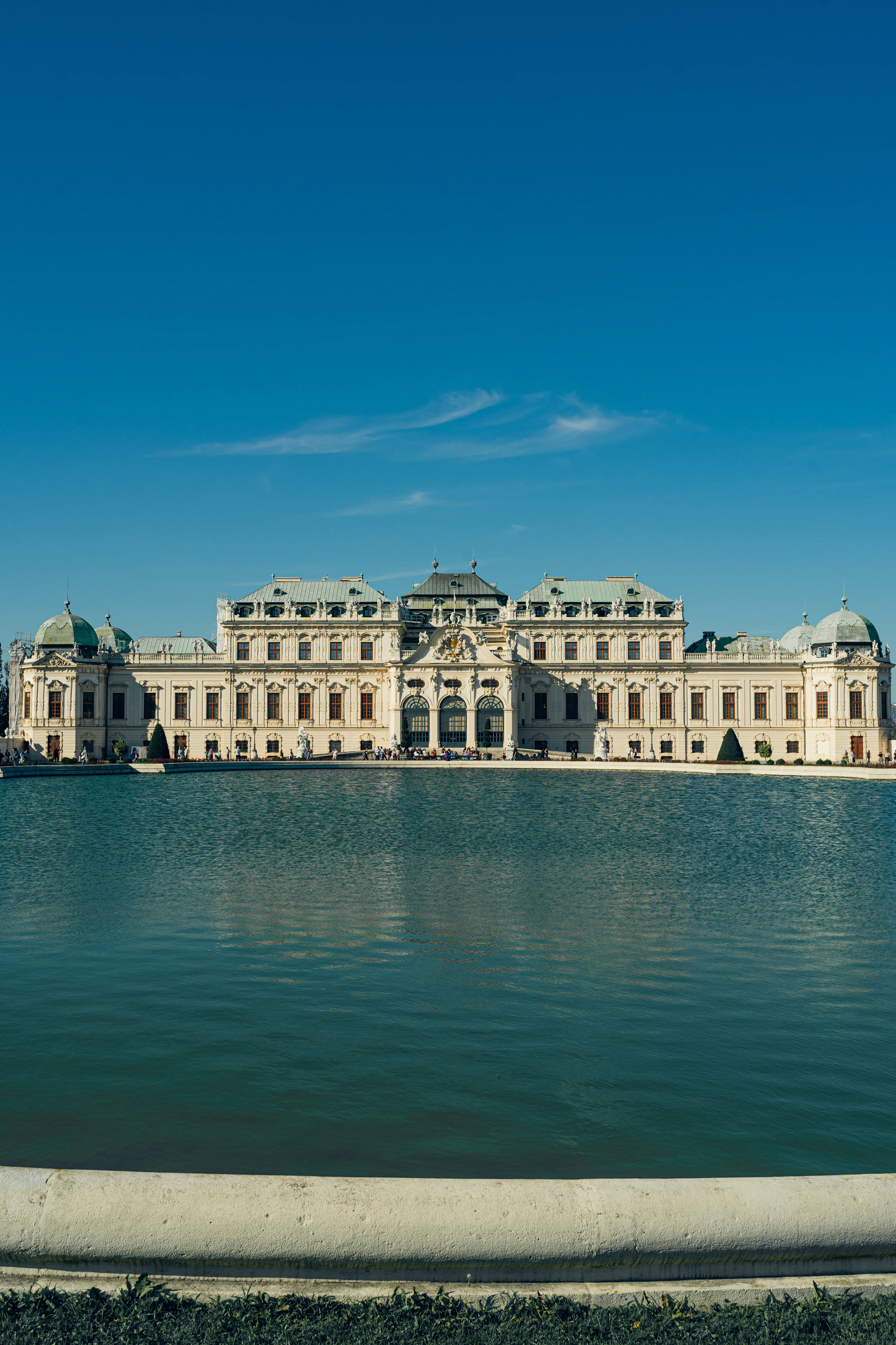 A large building sitting on top of a large body of water