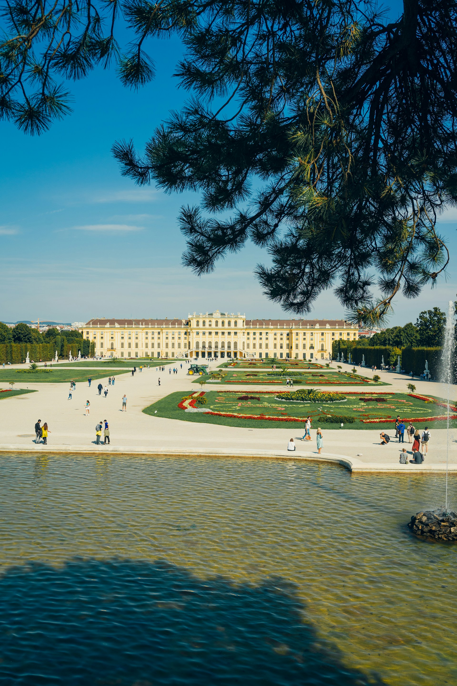 A large building with a fountain in front of it