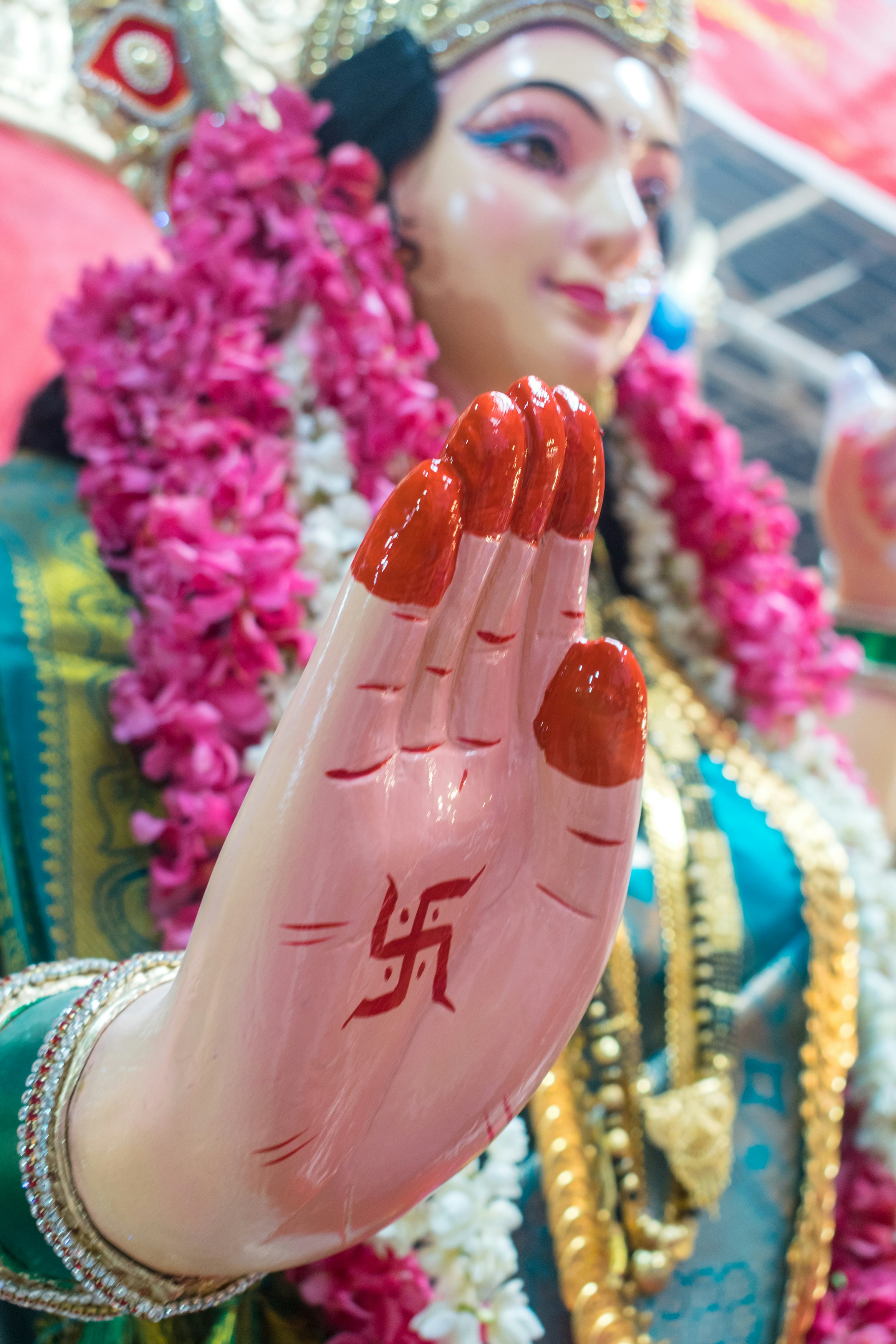 A close up of a statue of a person holding a hand