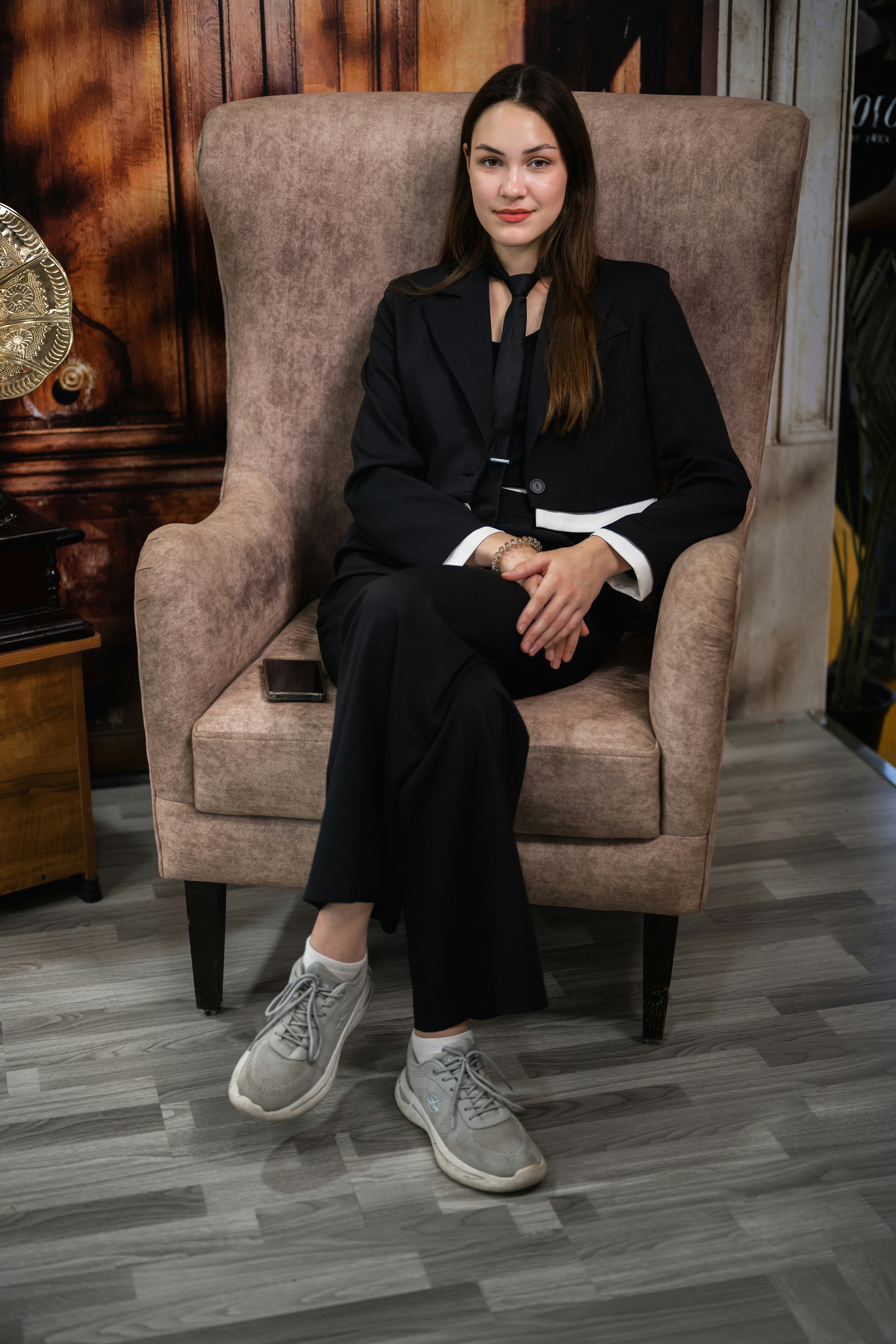 A woman sitting in a chair in a room