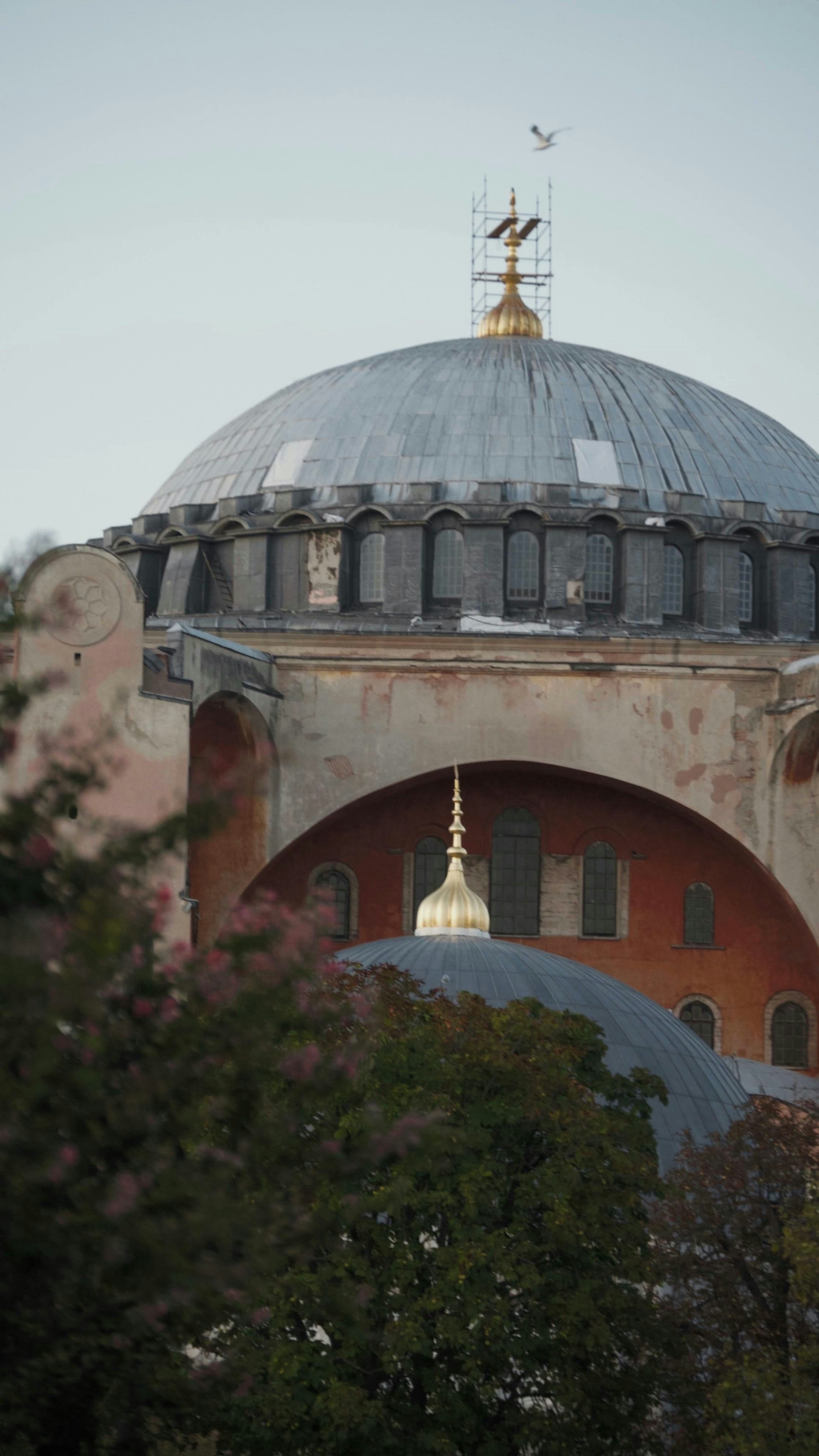 A large dome with a cross on top of it