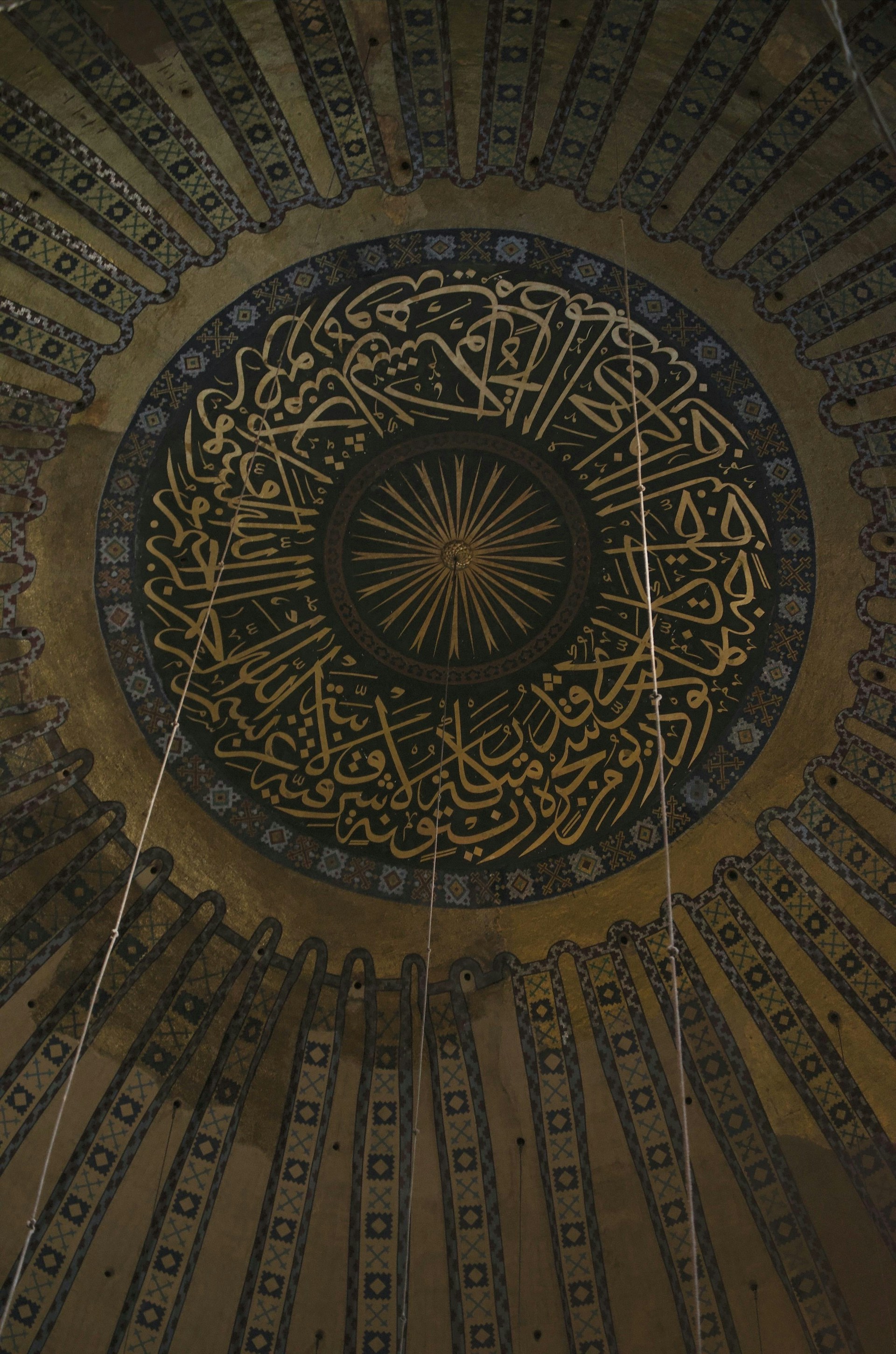 The ceiling of a building with intricate designs