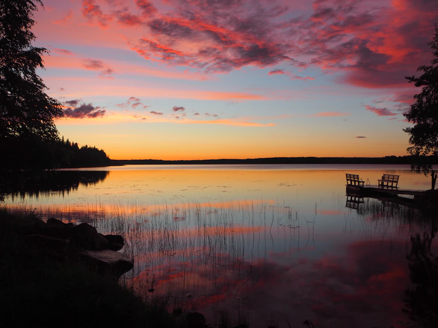 Lake and wooden dock at sunset near Tampere