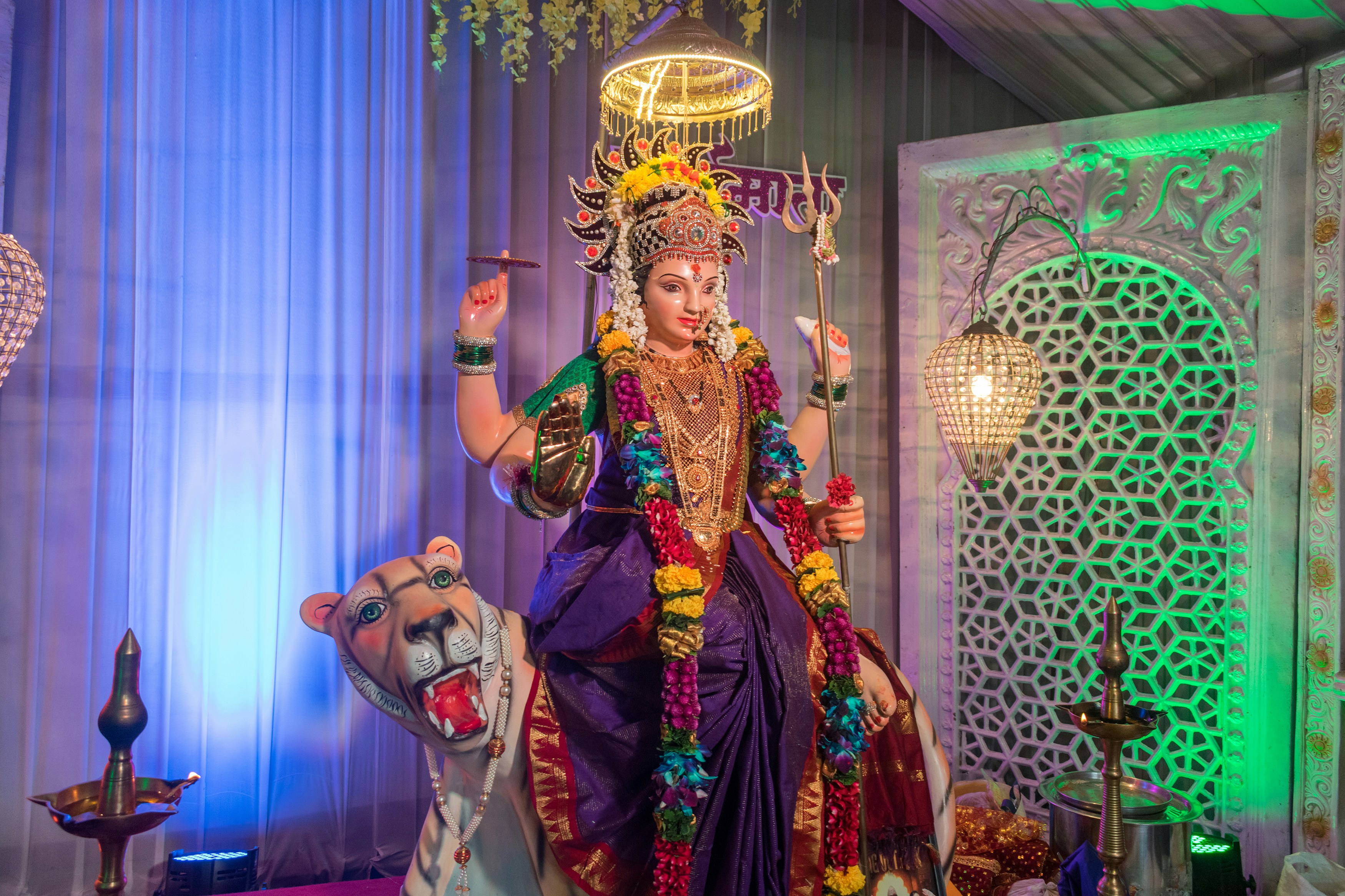A woman dressed in a costume standing on a stage