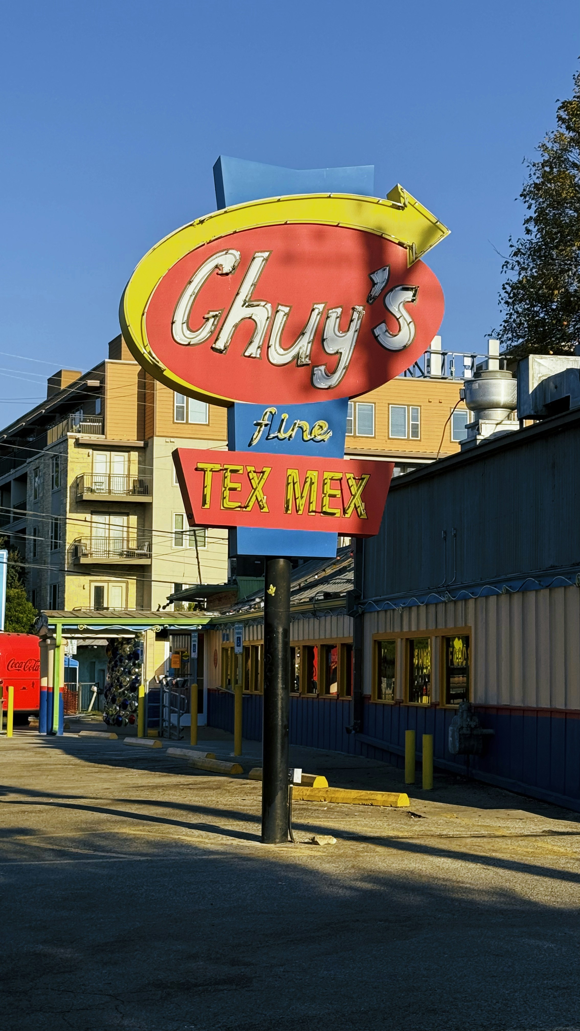 A sign for a restaurant called chug's fine tex mex