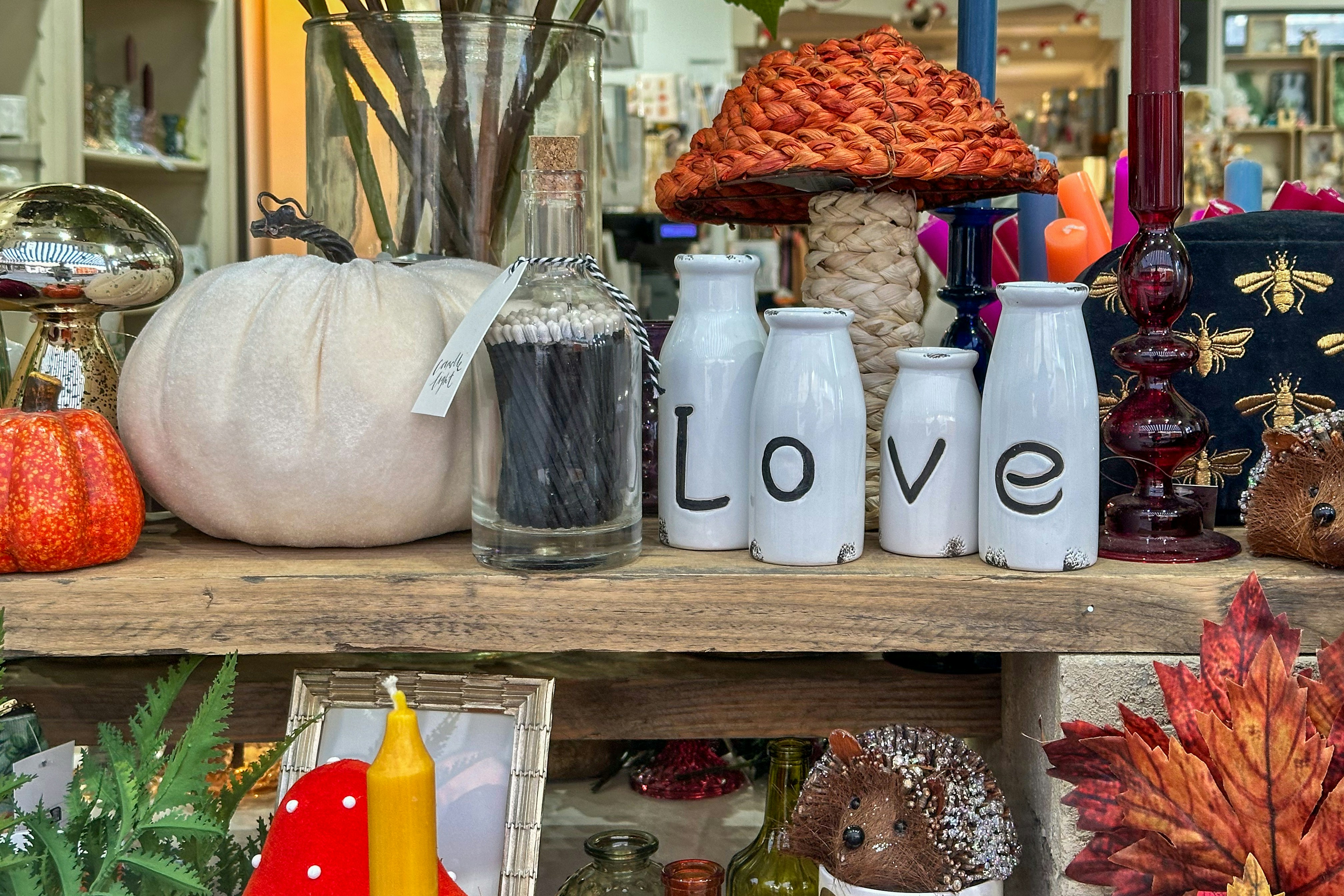 A shelf filled with lots of different types of items