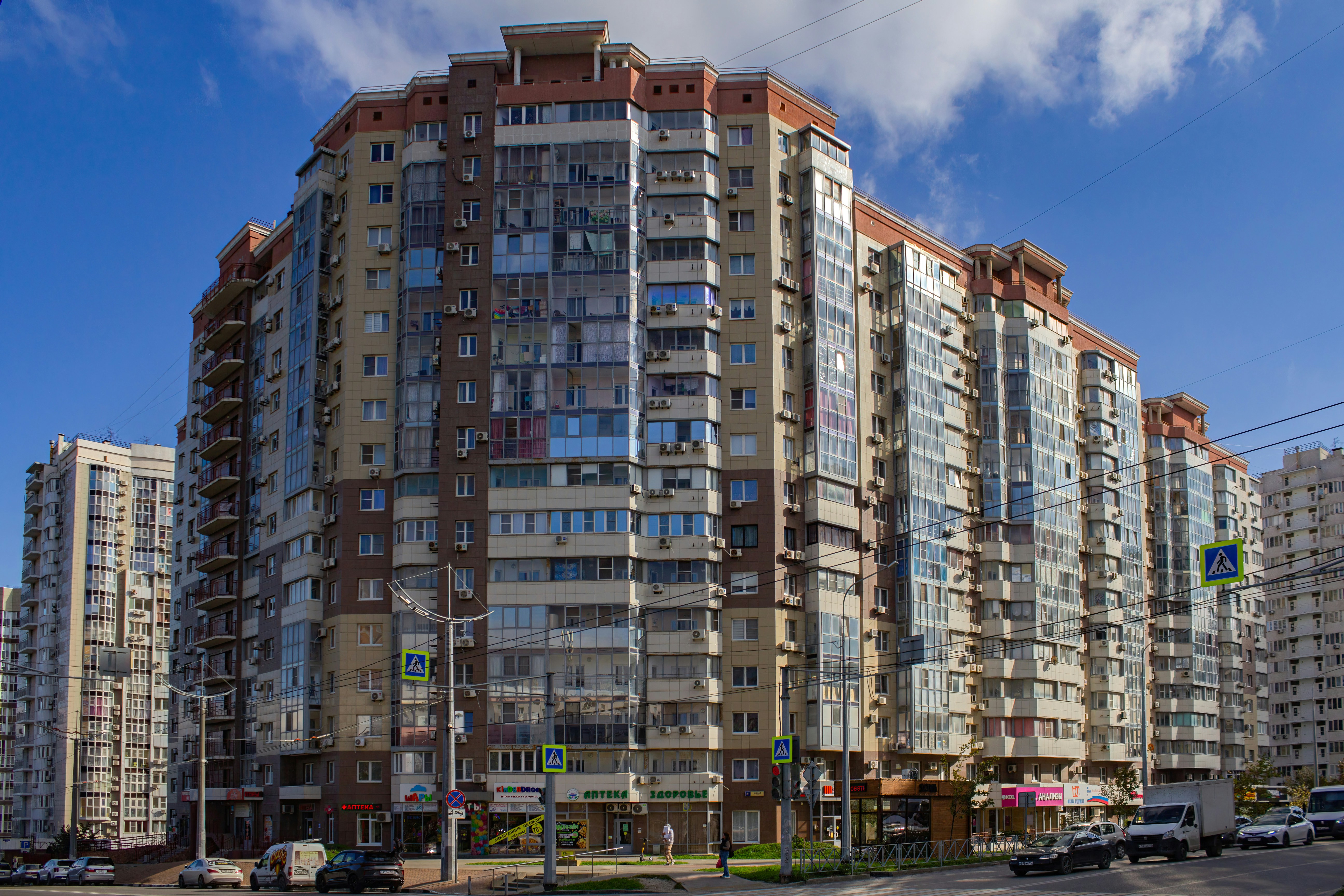 A very tall building sitting next to a parking lot