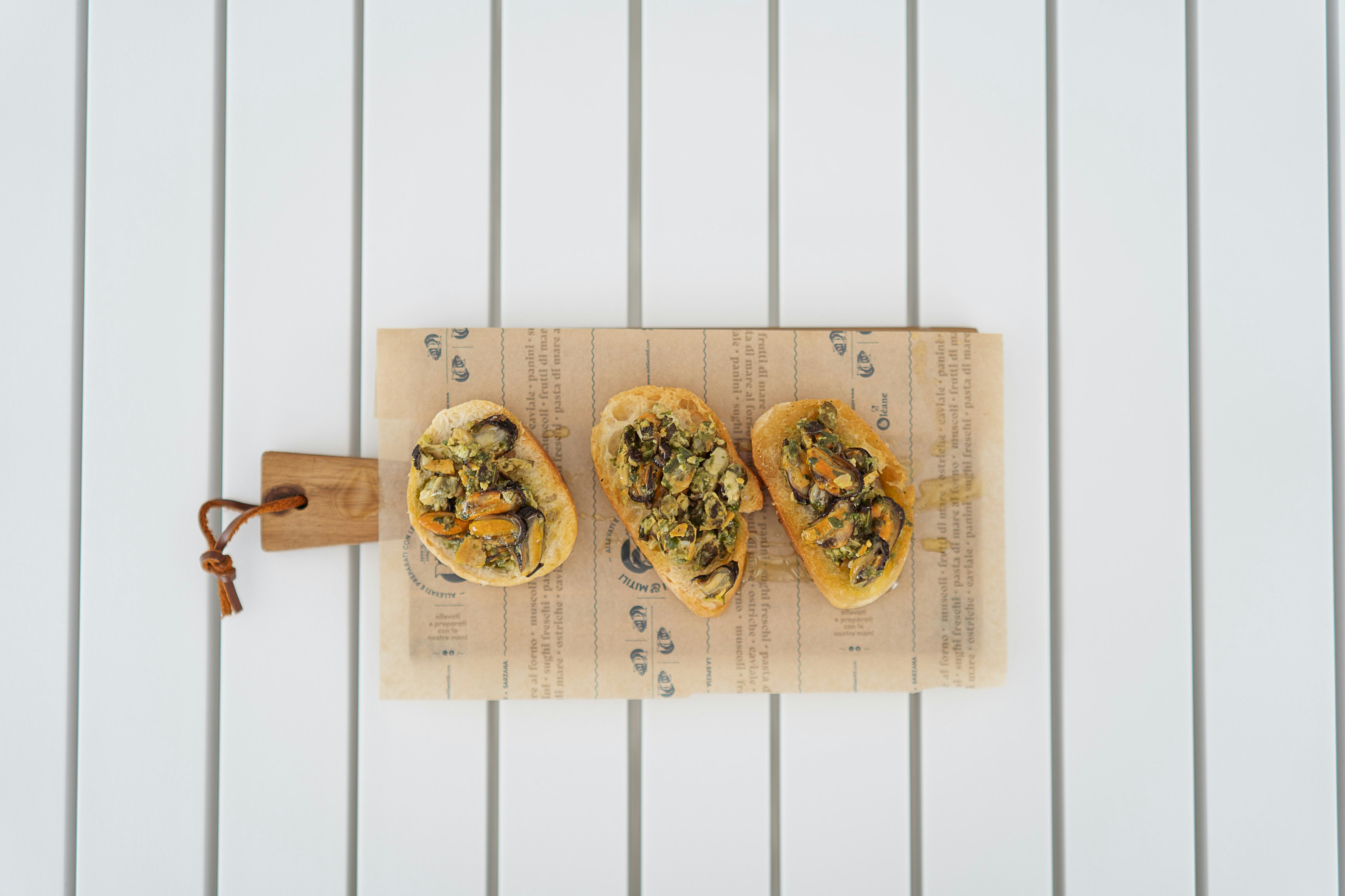 Toasts on a board on white slats