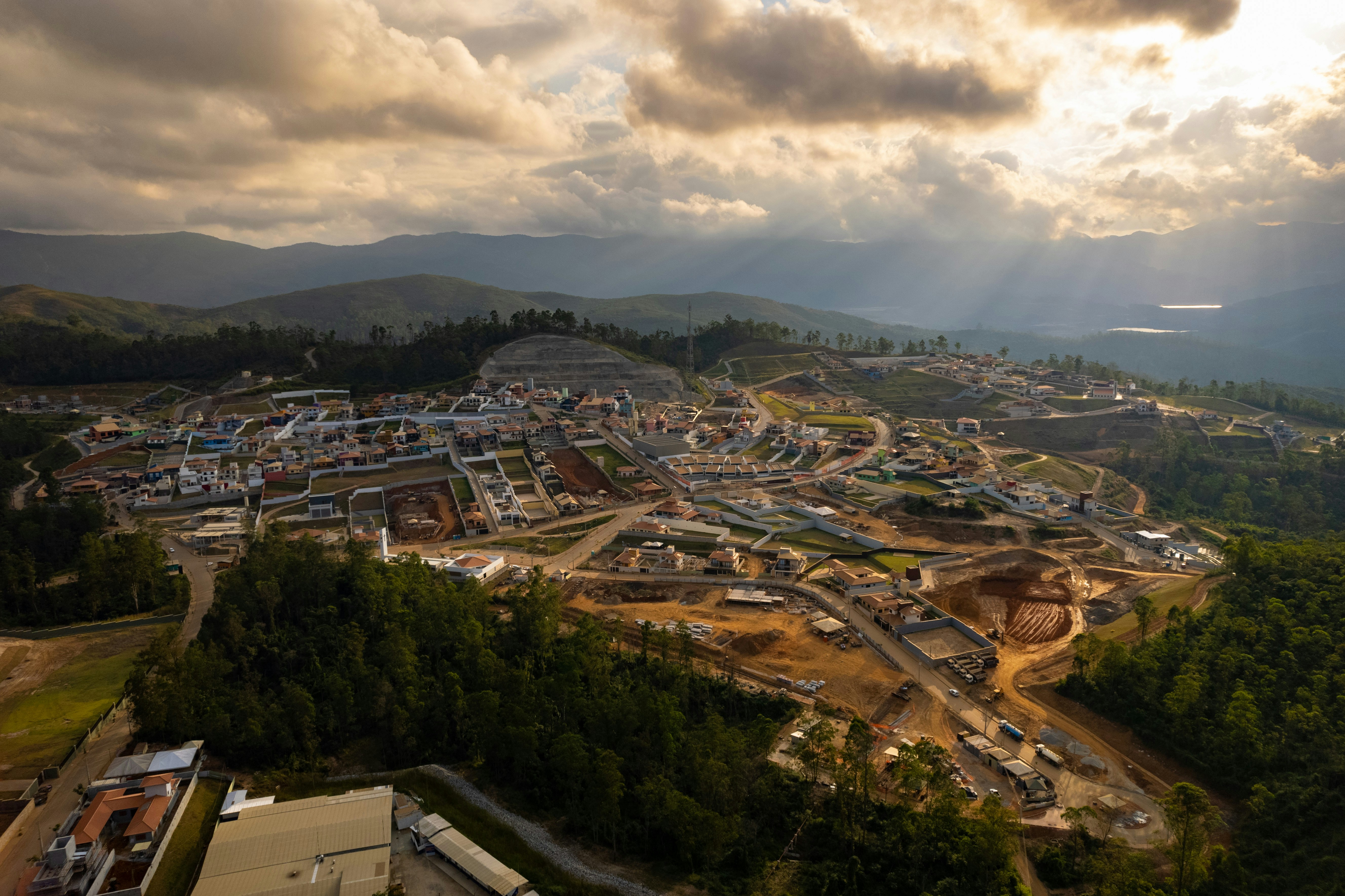 An aerial view of a construction site under a cloudy sky