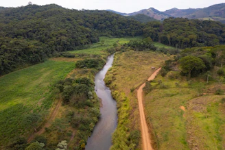 A river running through a lush green countryside