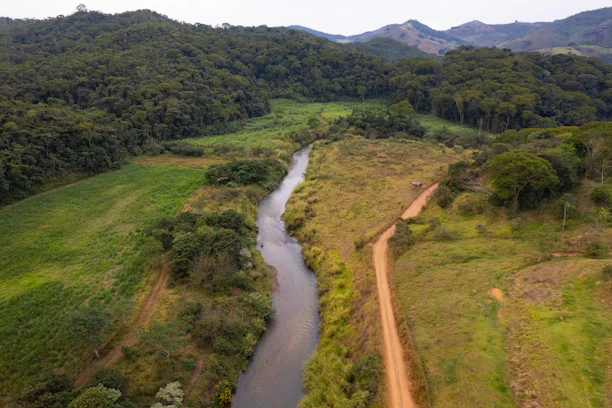 A river running through a lush green countryside