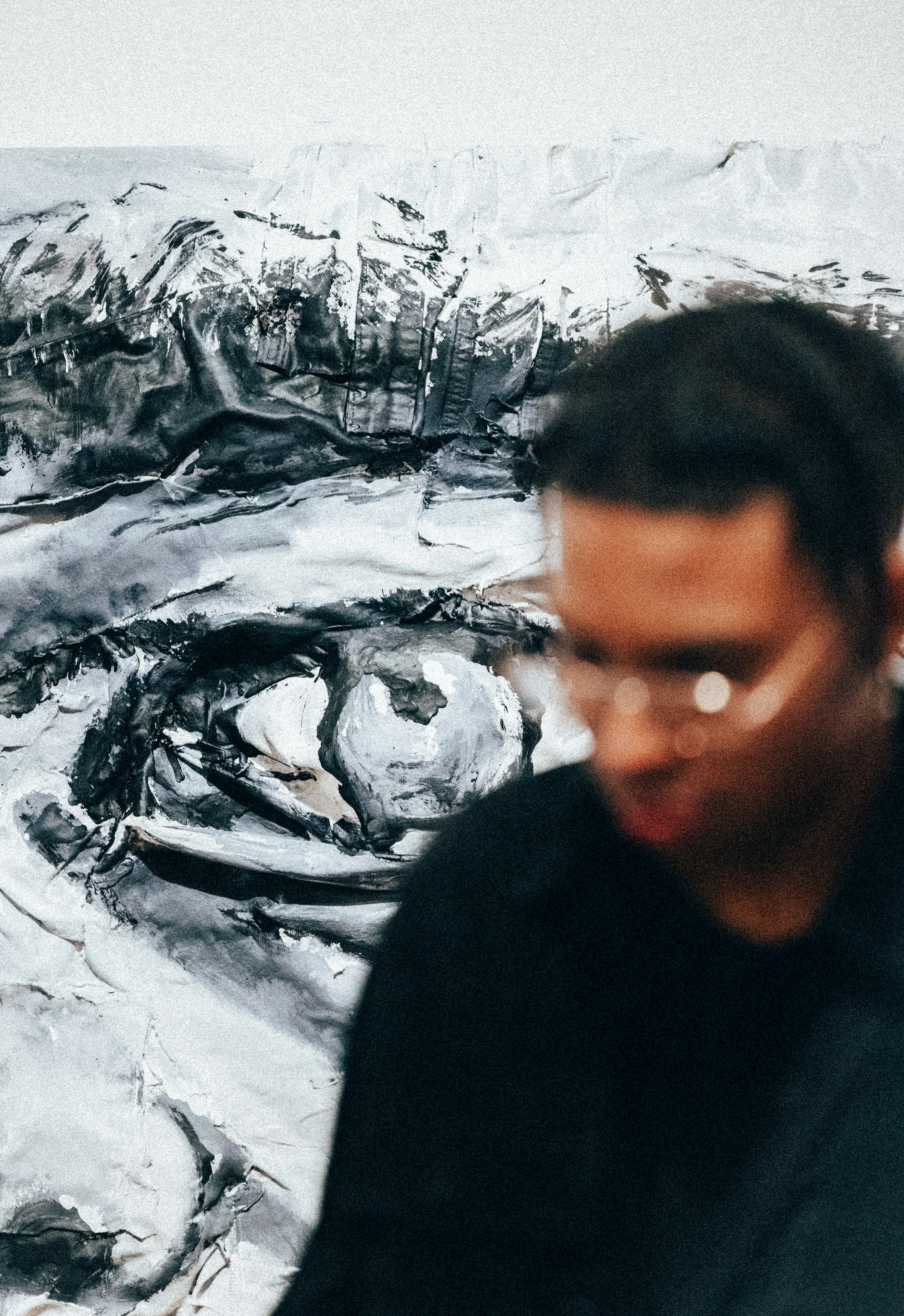 A man standing in front of a large painting photo – Free Woman Image on ...