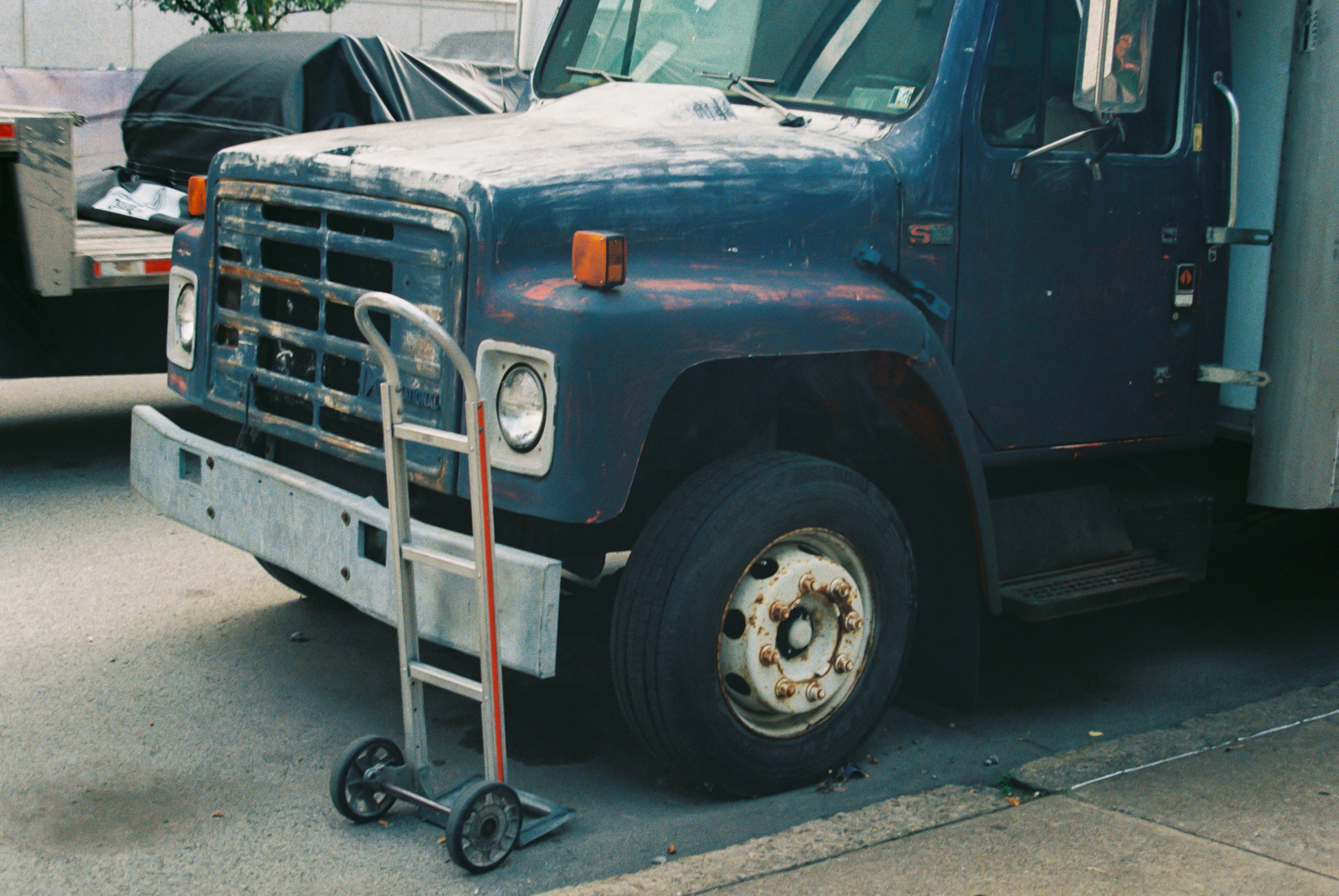 Disabled semi truck at a rest stop awaiting long distance towing - long distance semi truck towing