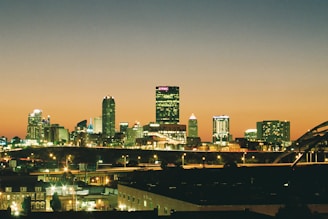 A view of a city at night from across the river