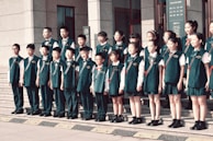 A group of children standing in front of a building