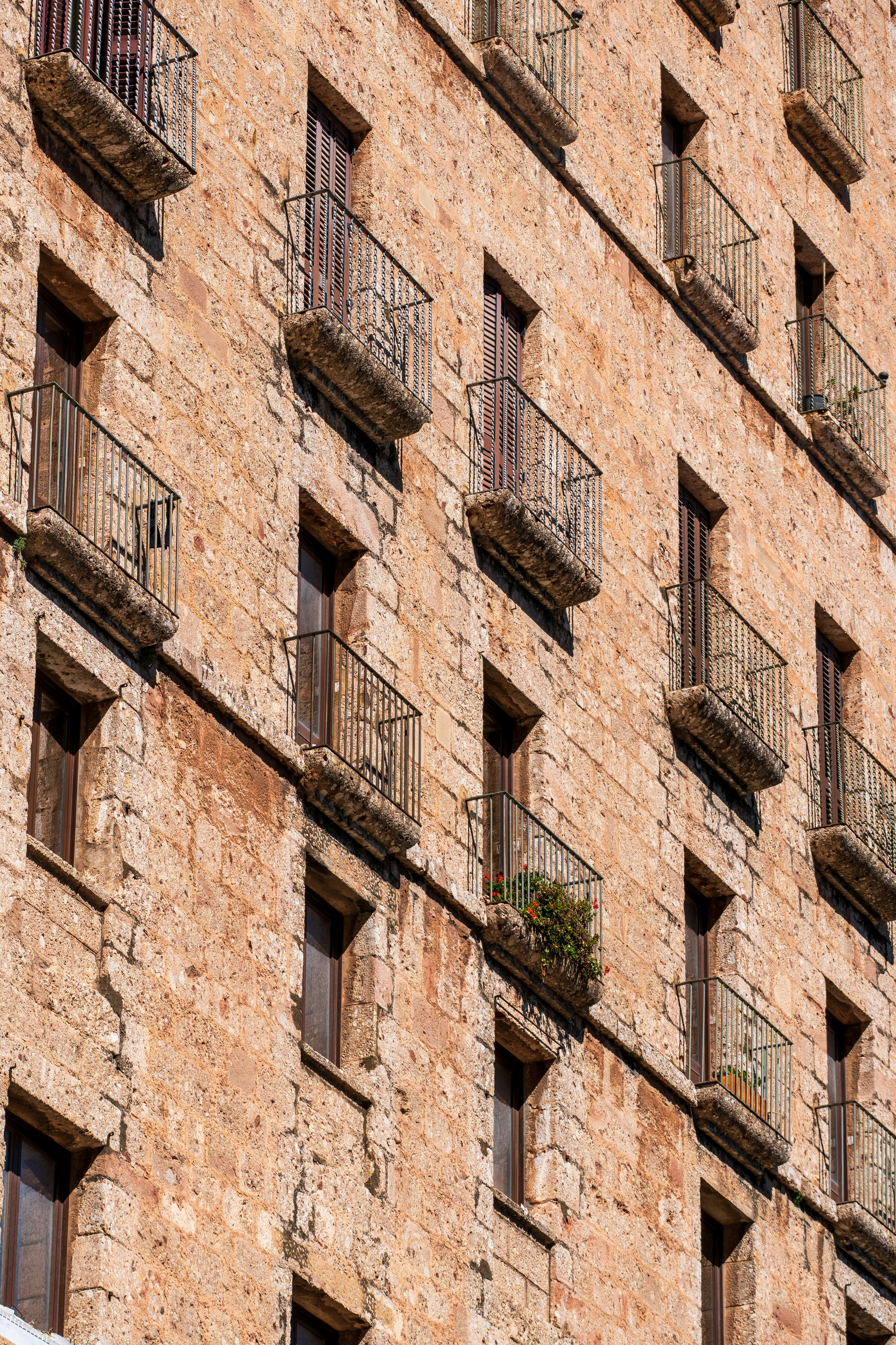 A tall brick building with lots of windows