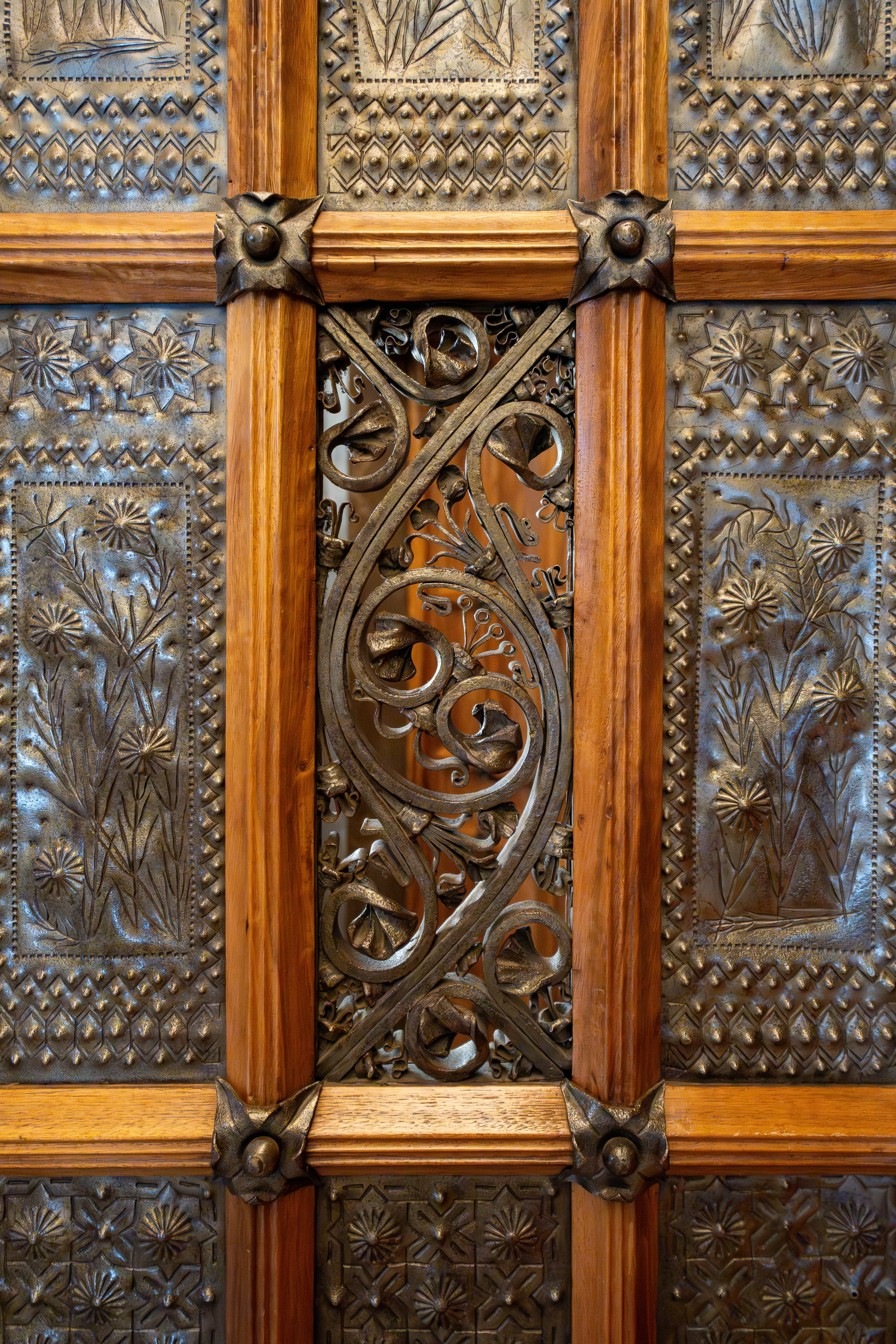 A close up of a wooden door with intricate carvings