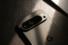 A close up of a cell phone on a table