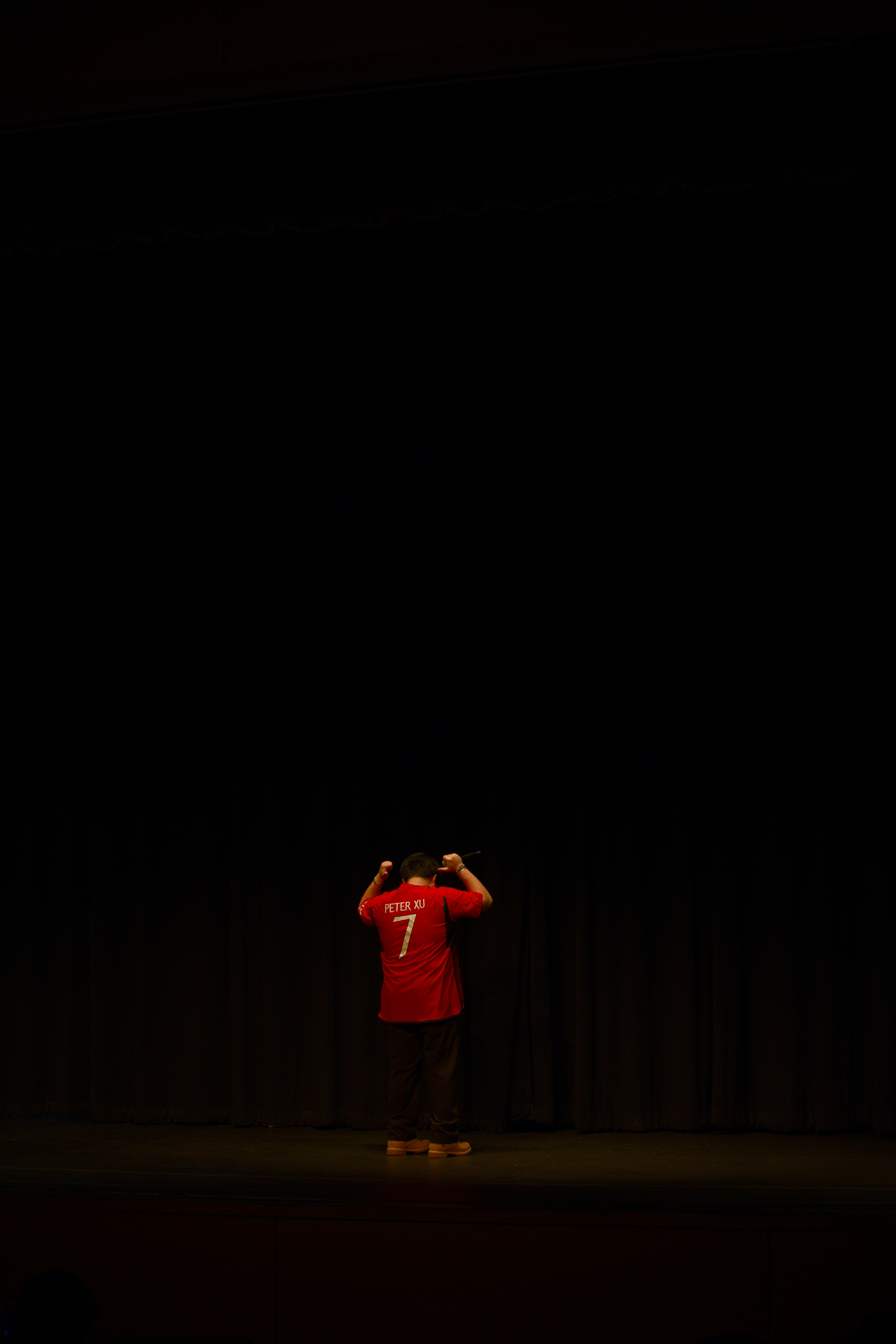 A man standing on a stage with a microphone