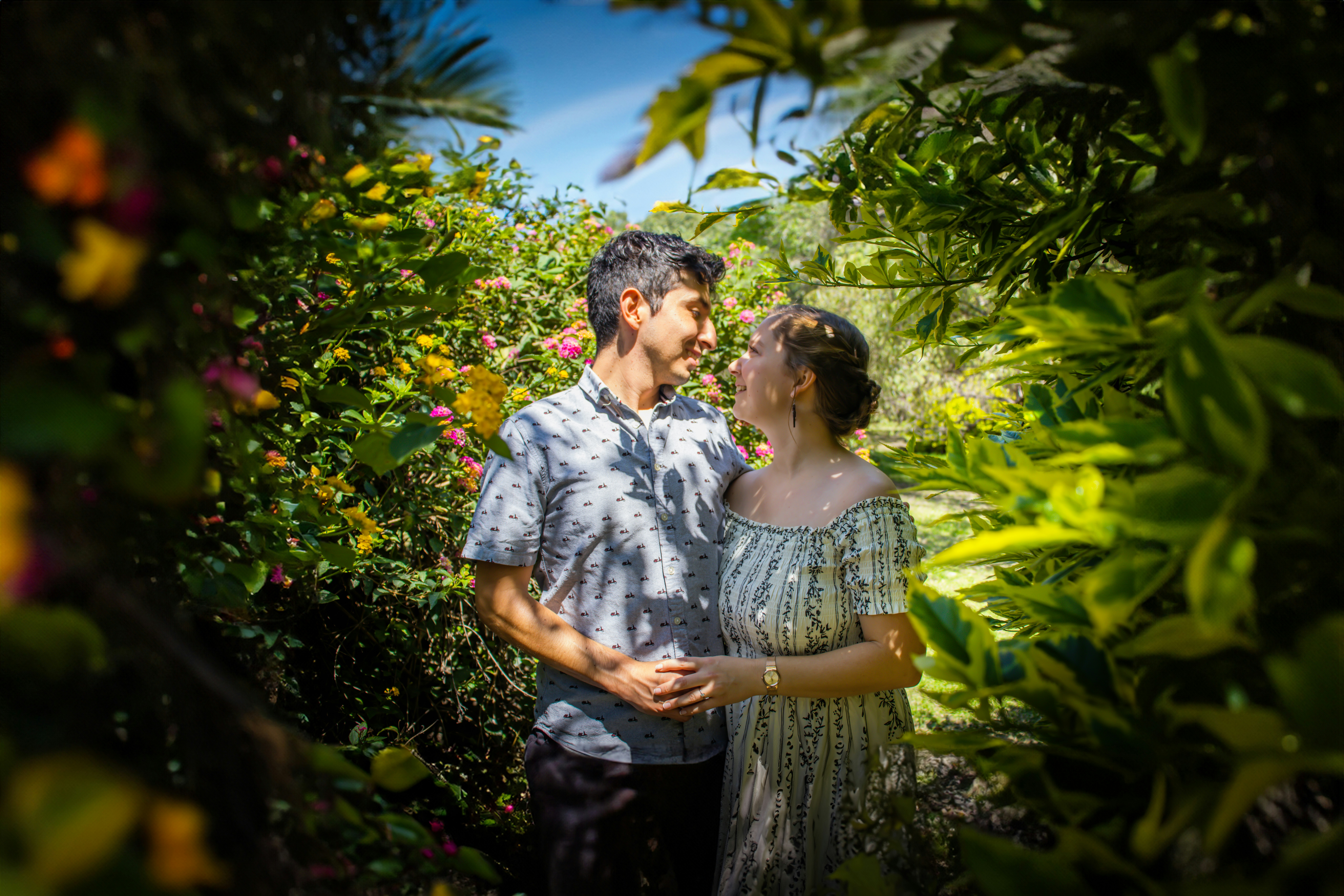 A man and a woman standing in a garden