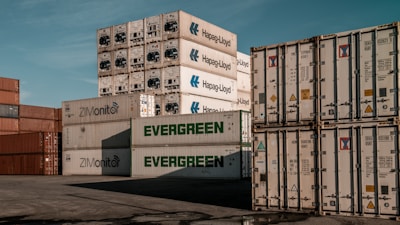 A bunch of containers stacked on top of each other