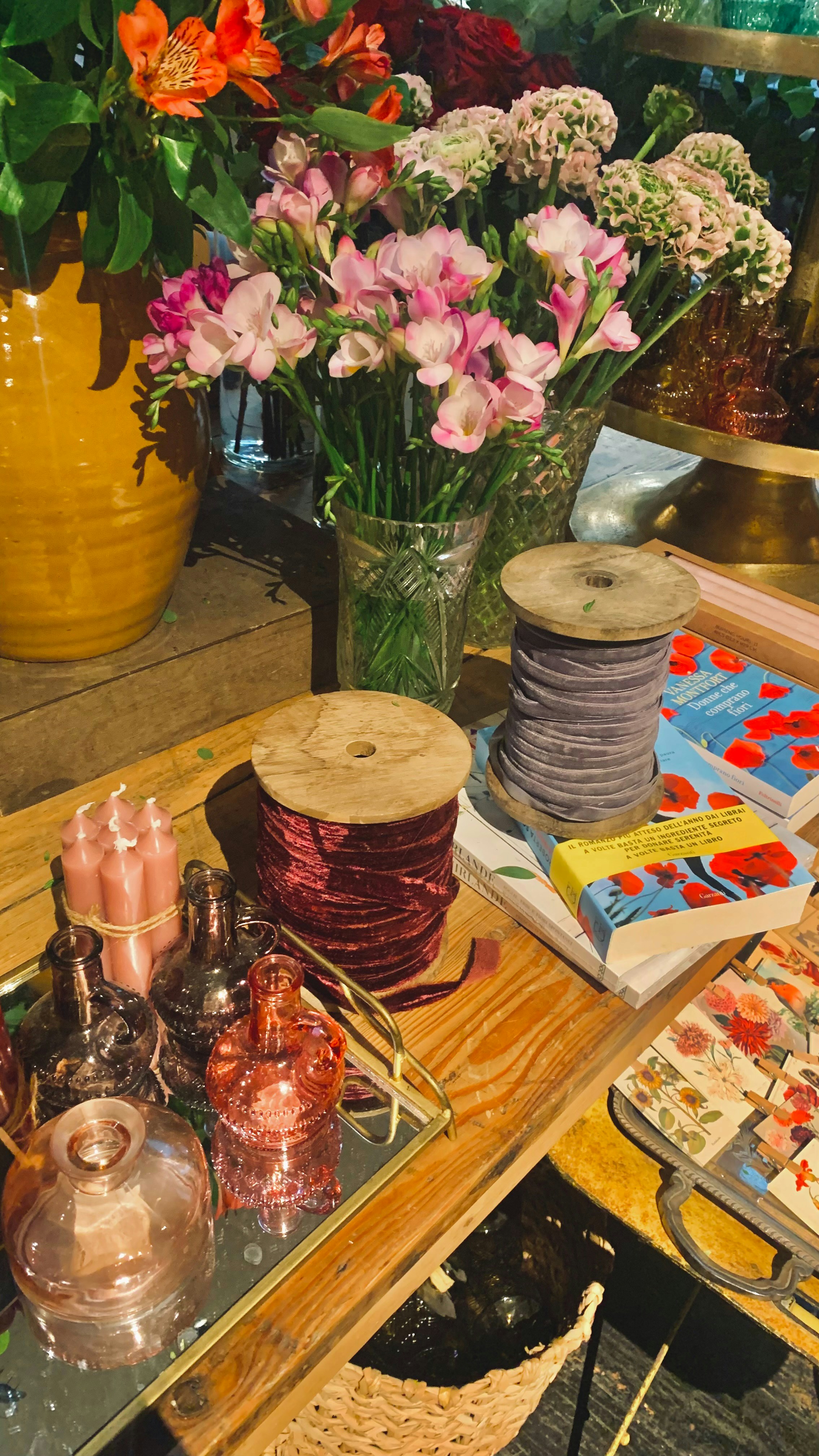 Antique wooden furniture and vintage items displayed in a bright estate clearance setting