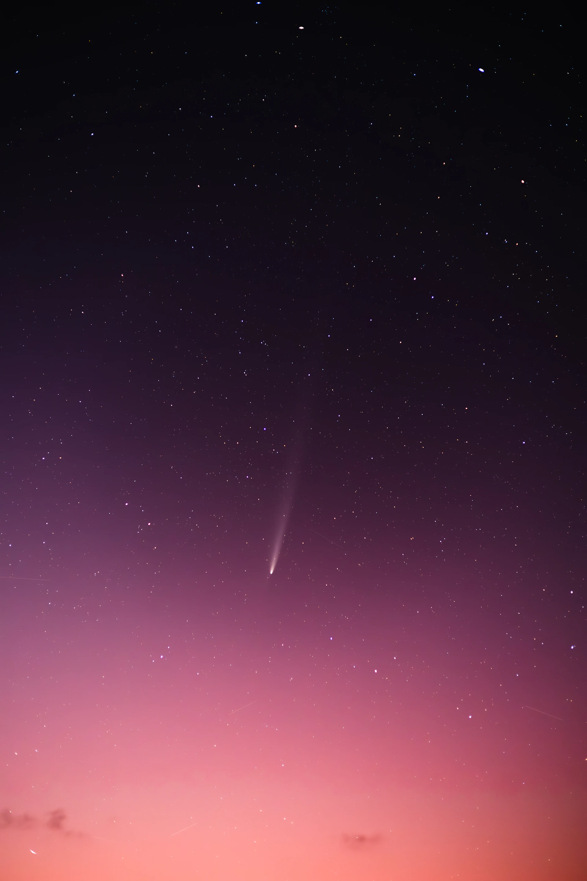 The sky is filled with stars as the sun sets