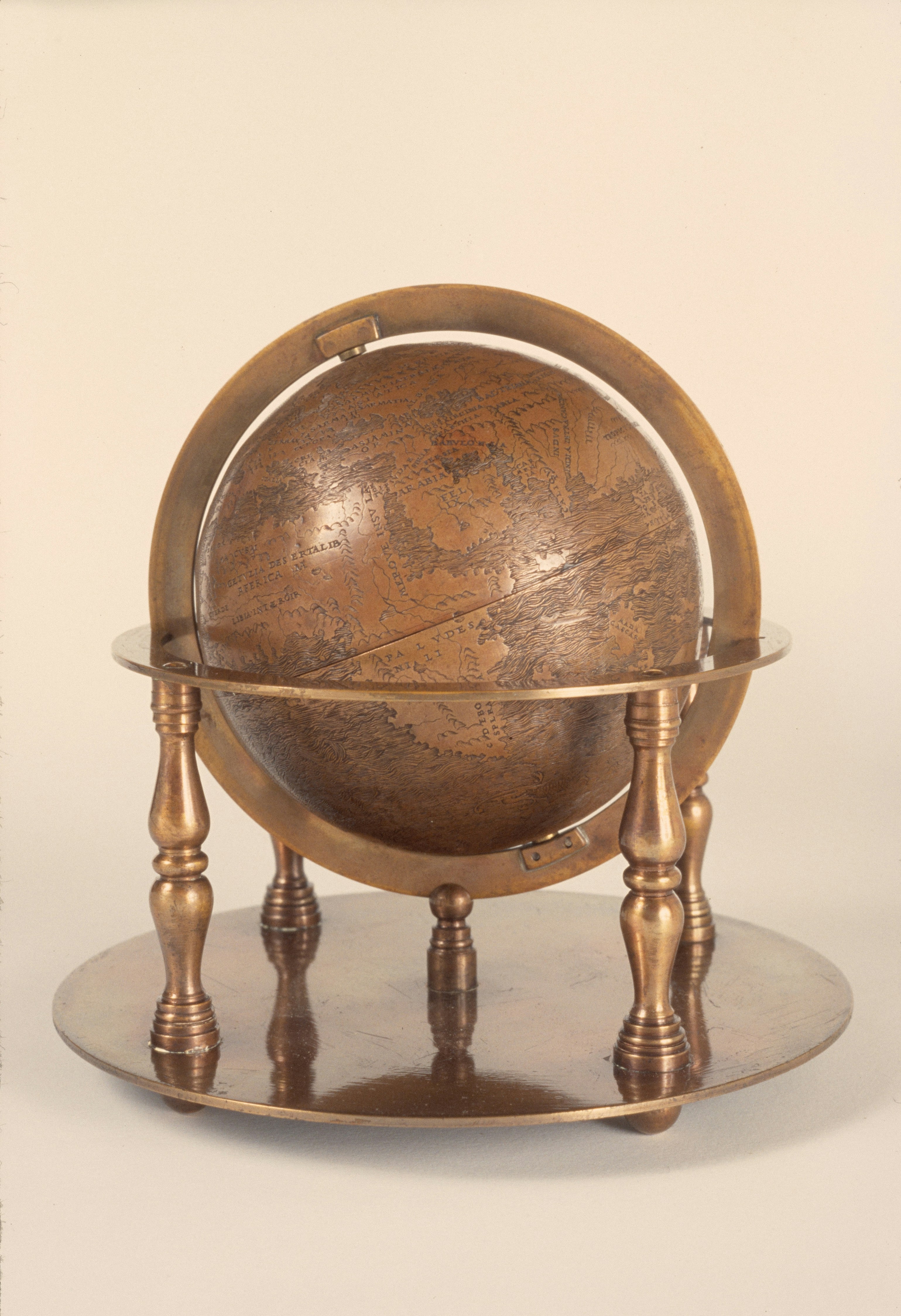 Antique bronze globe on a stand