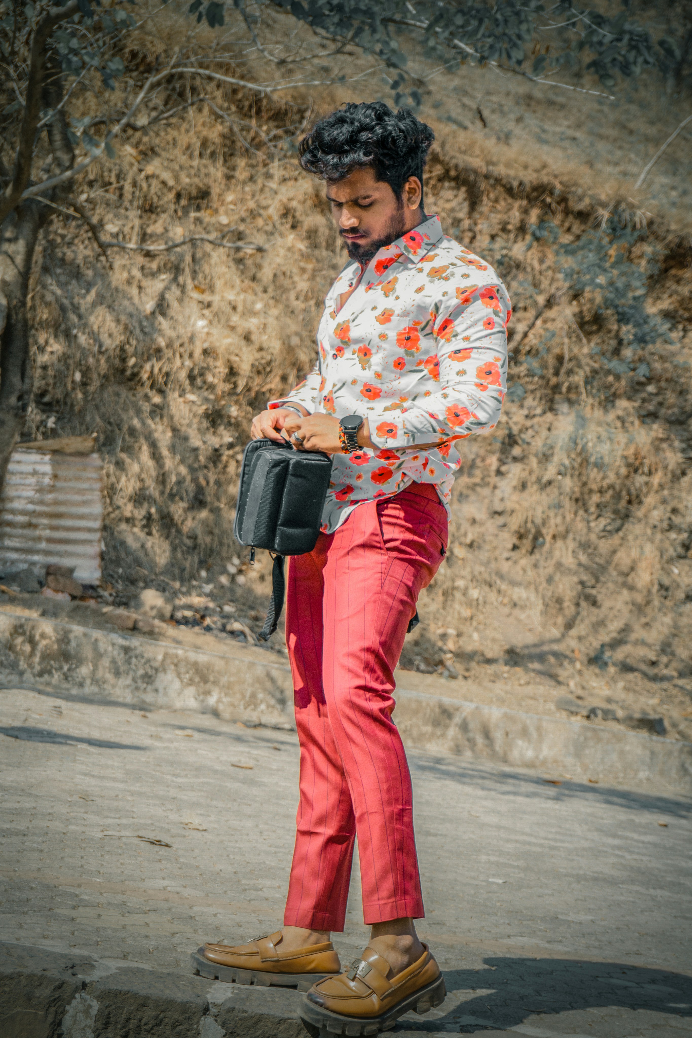 A man riding a skateboard down a street