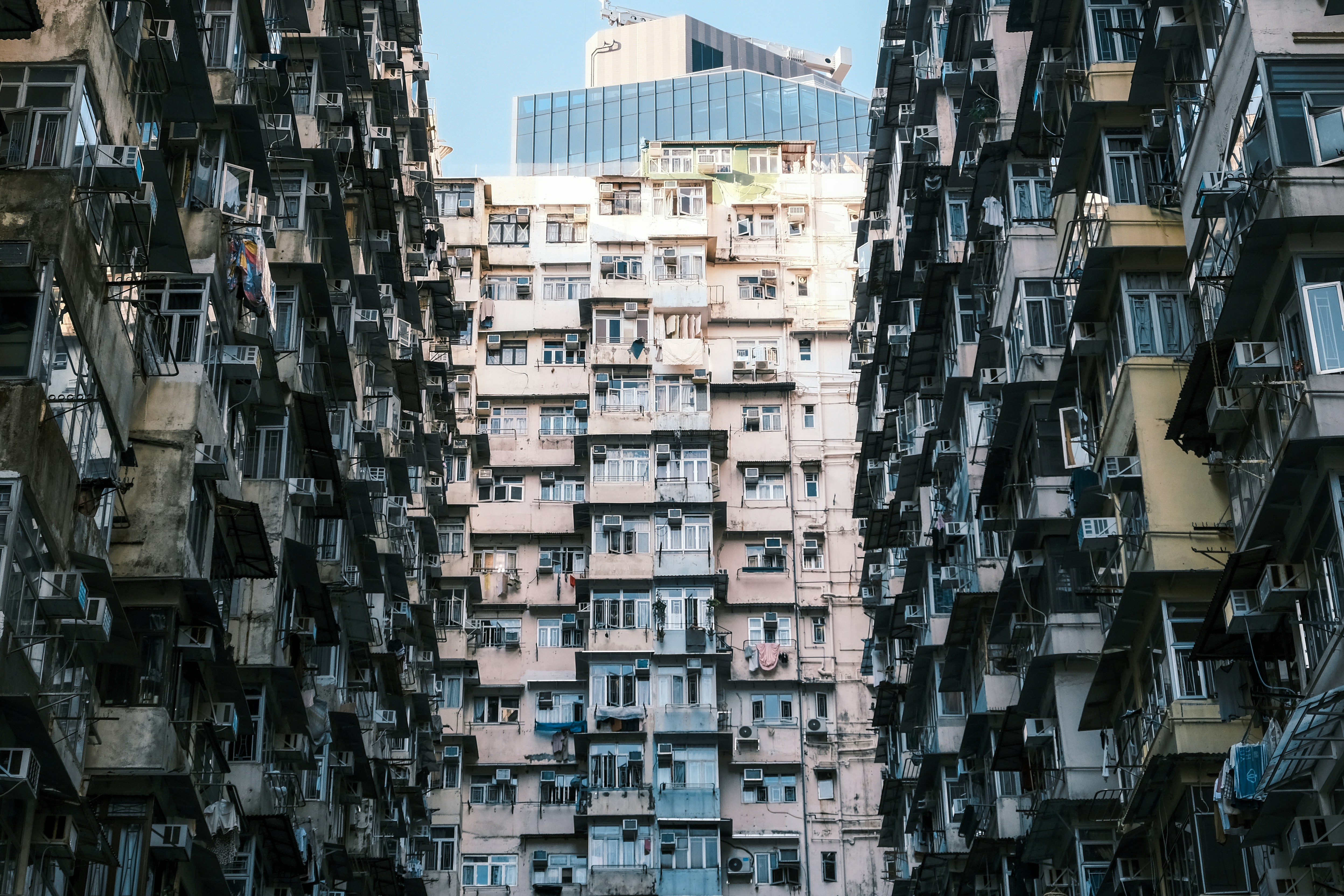 A very tall building with lots of balconies, 