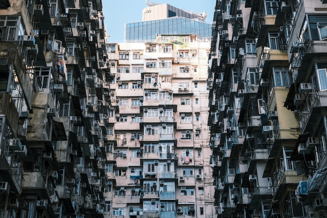 A very tall building with lots of balconies,