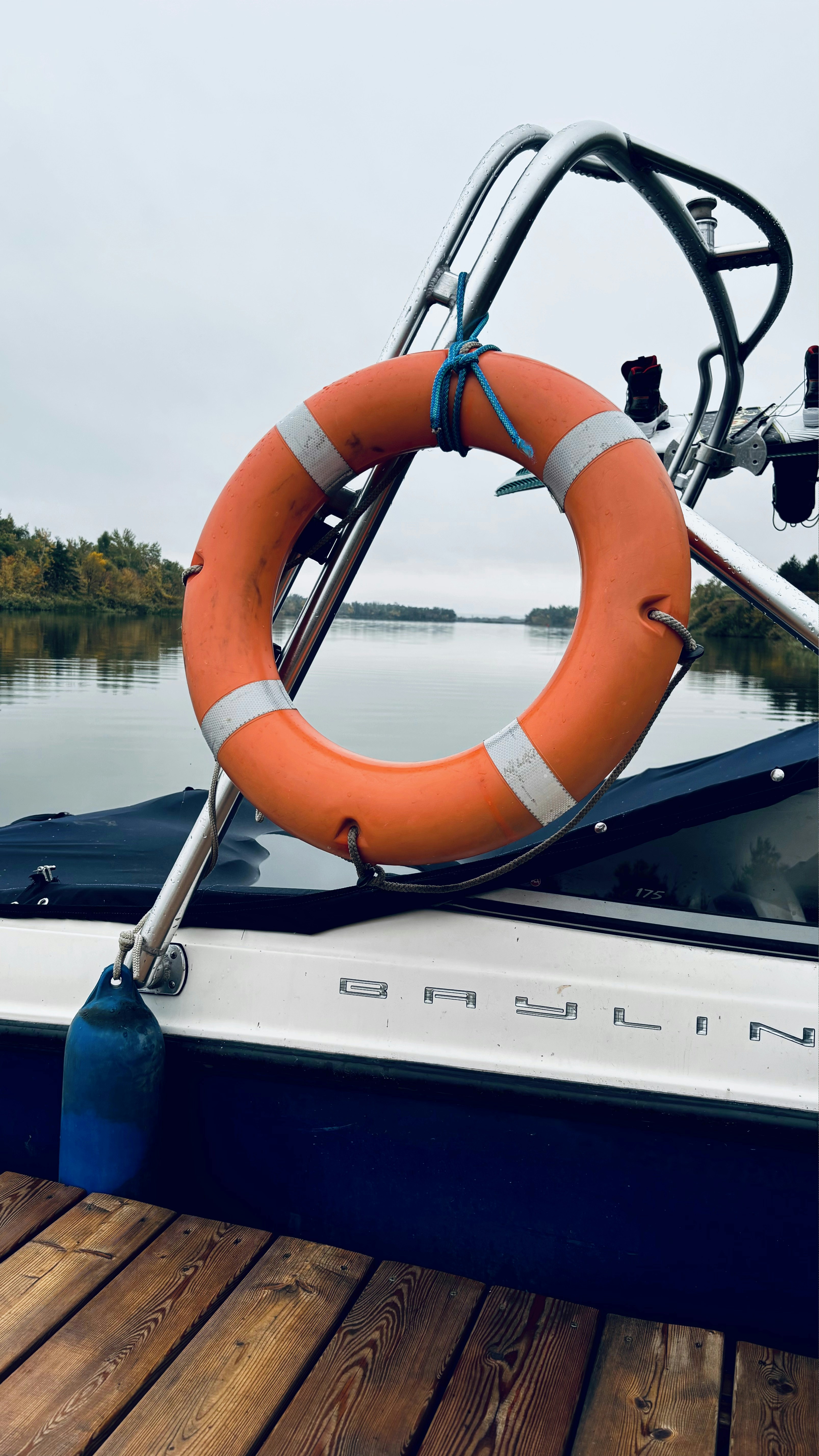 A life preserver on a boat in a body of water photo – Free Travel Image ...