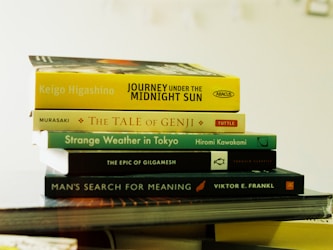 A stack of books sitting on top of a table